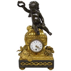 Denière Gilt Bronze Clock with a Cherub