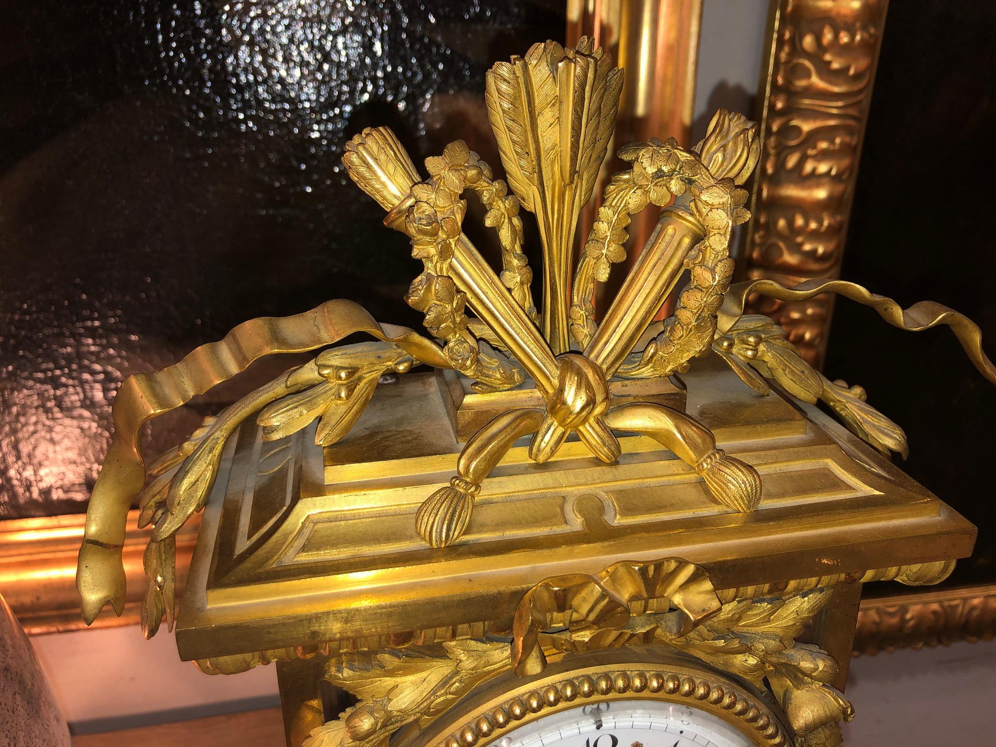 European Deniere Gilt Bronze Mantle Clock in the Louis XVI taste.  For Sale