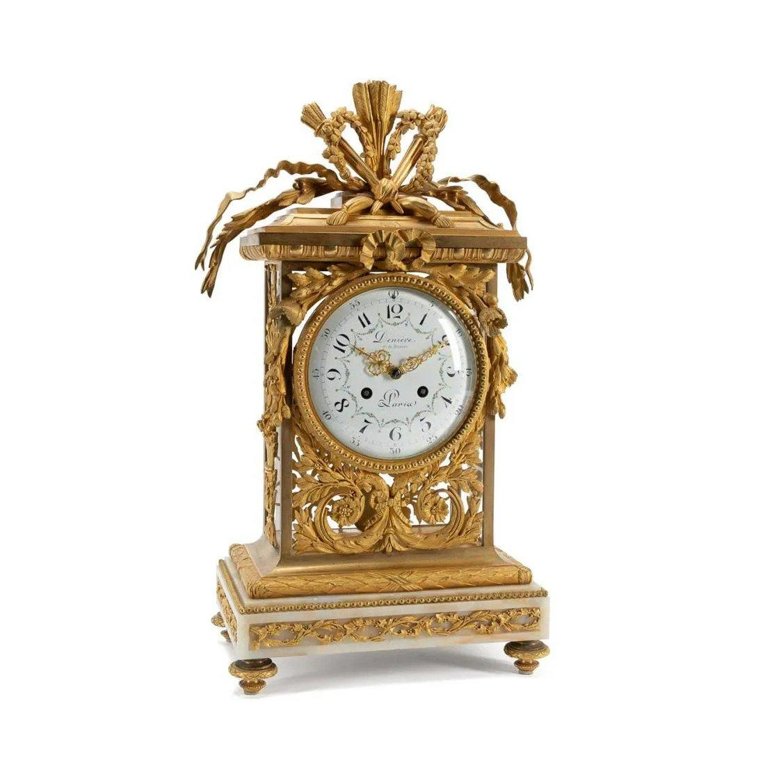 The case Jean-Francois and/or Guillaume Deniere (French, 1820-1901); the mechanism (Samuel Marti et Cie (French, 1841- ), circa 1870, finely cast gilt bronze and marble mantel clock in the Louis XVI taste, surmounted by a ribbon tied quiver and
