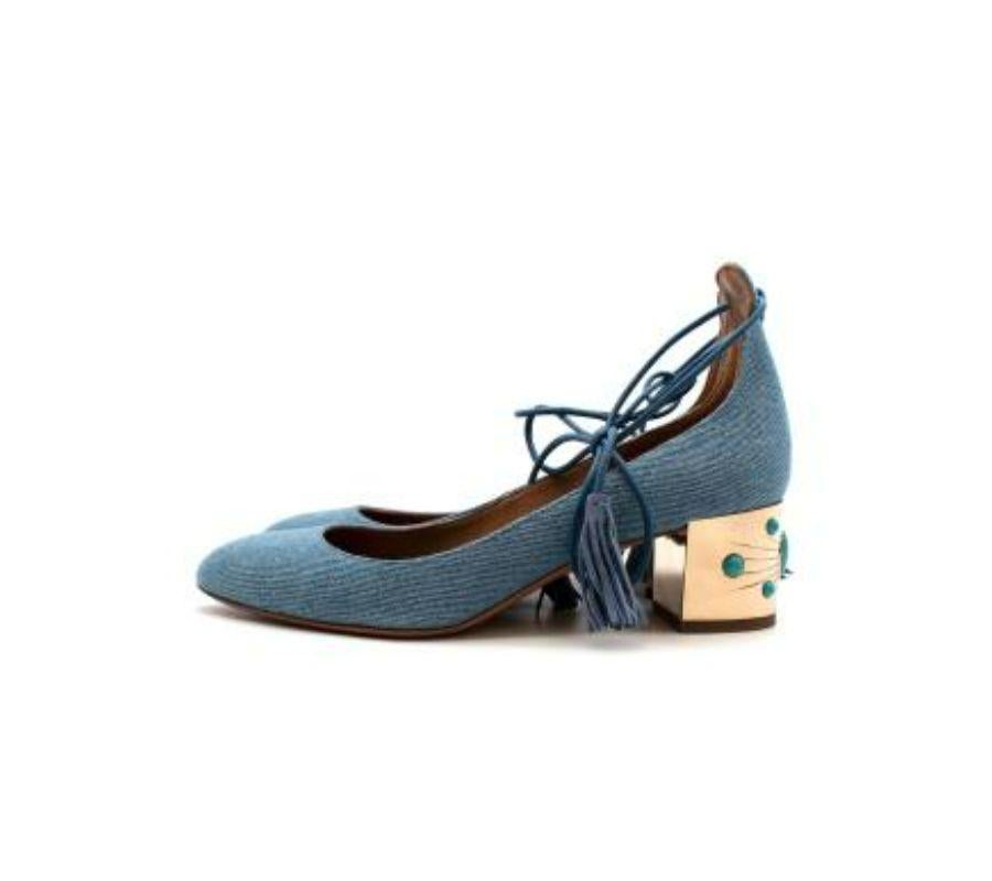 Aquazzura denim ankle wrap block-heeled pumps
 
 - Light blue wash denim pumps with rounded toe 
 - Tied ankle straps with tassels
 - Brown leather interior
 - Gold-tone block heel with turquoise speckled stone embellishments
 
 Materials
 Leather &