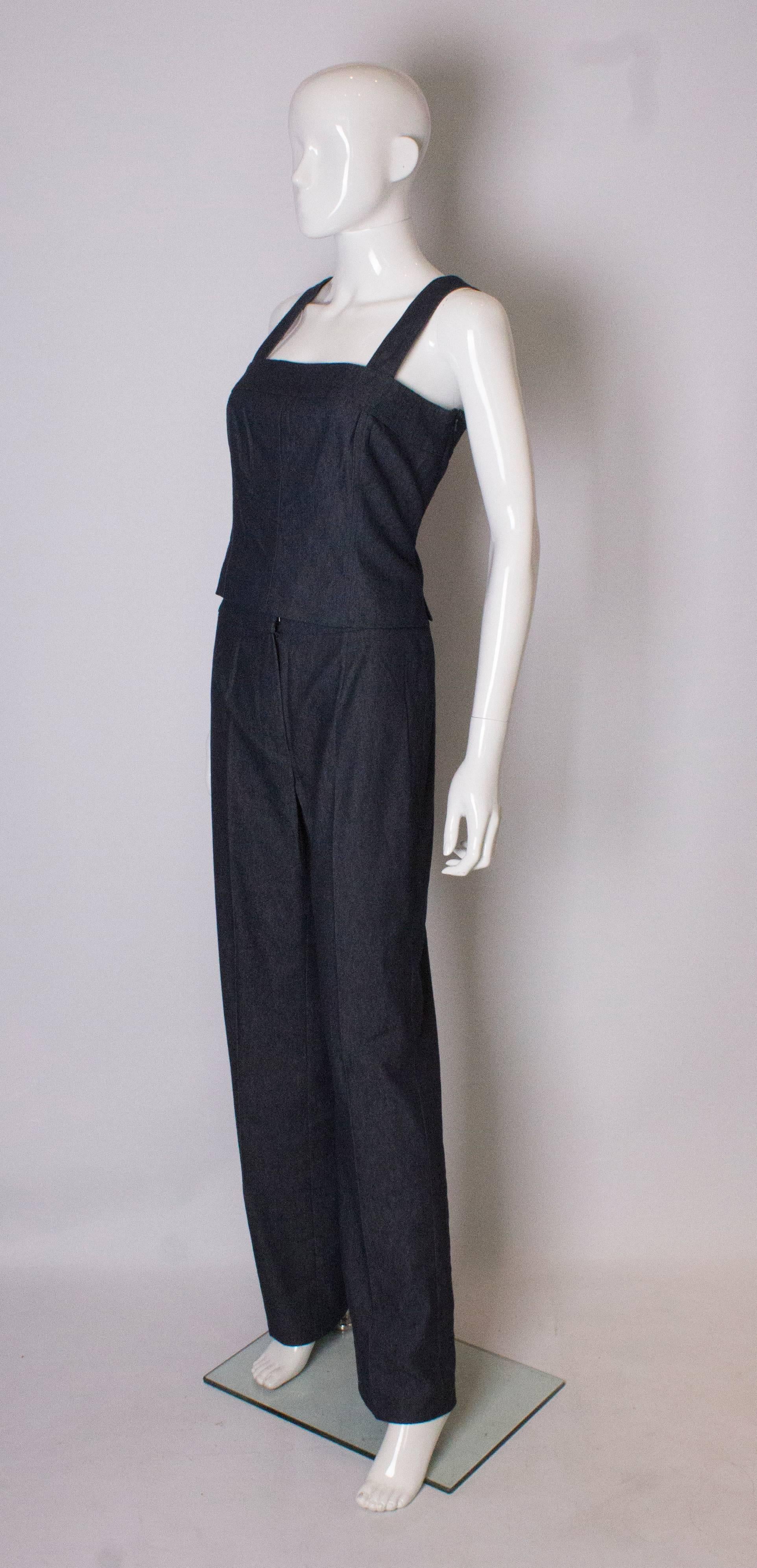 A chic two piece by Carlisle. The top is fully lined, has a side zip opening and two wide shoulder straps.There is a 2'' slit at either side.
The trousers have a 2'' hem.
Top bust 35/36'',  trousers waist 30'',inside leg 34''
