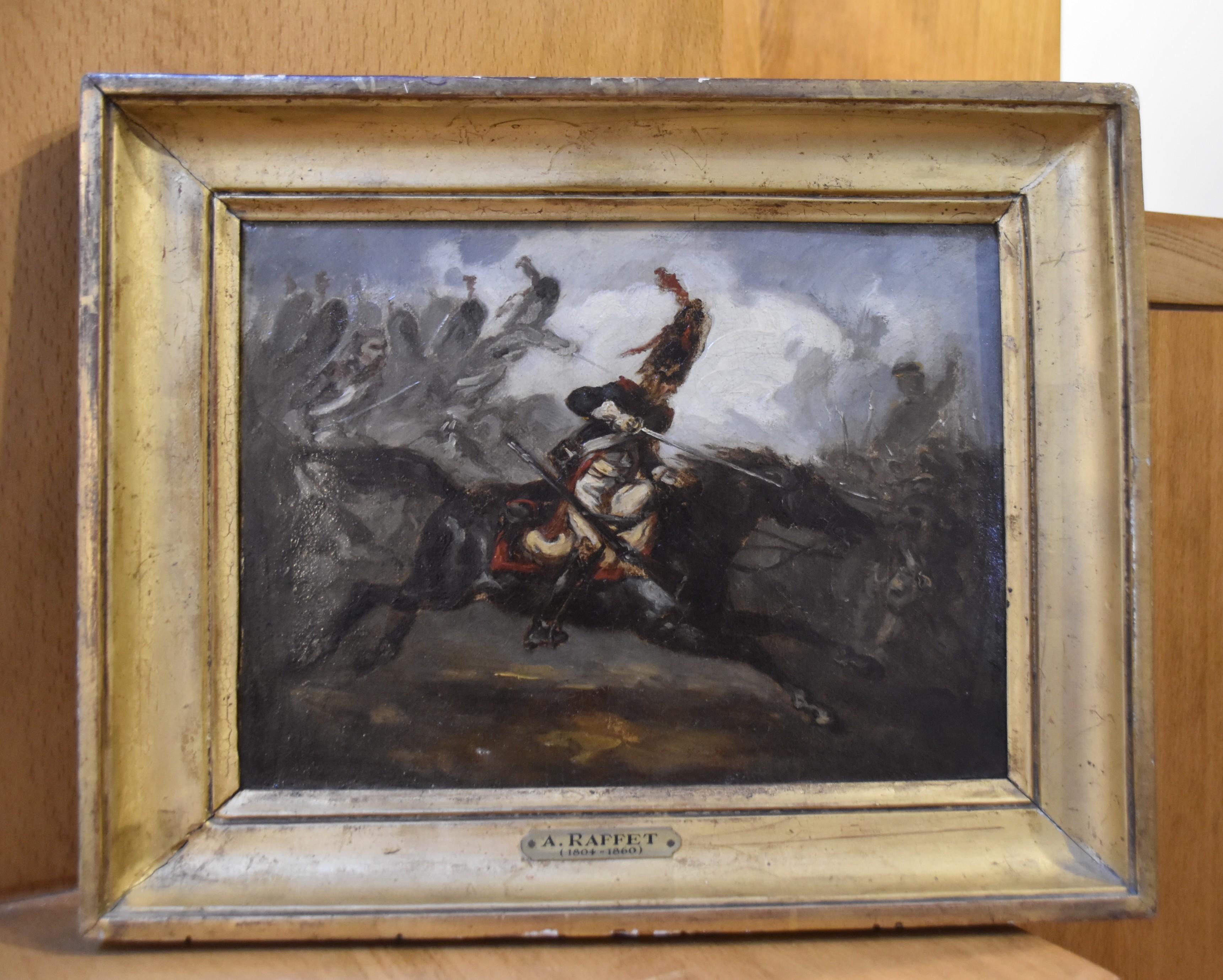 Denis Auguste Raffet (1804-1860)  A charging Hussar, oil on canvas - Painting by Denis Auguste Marie Raffet