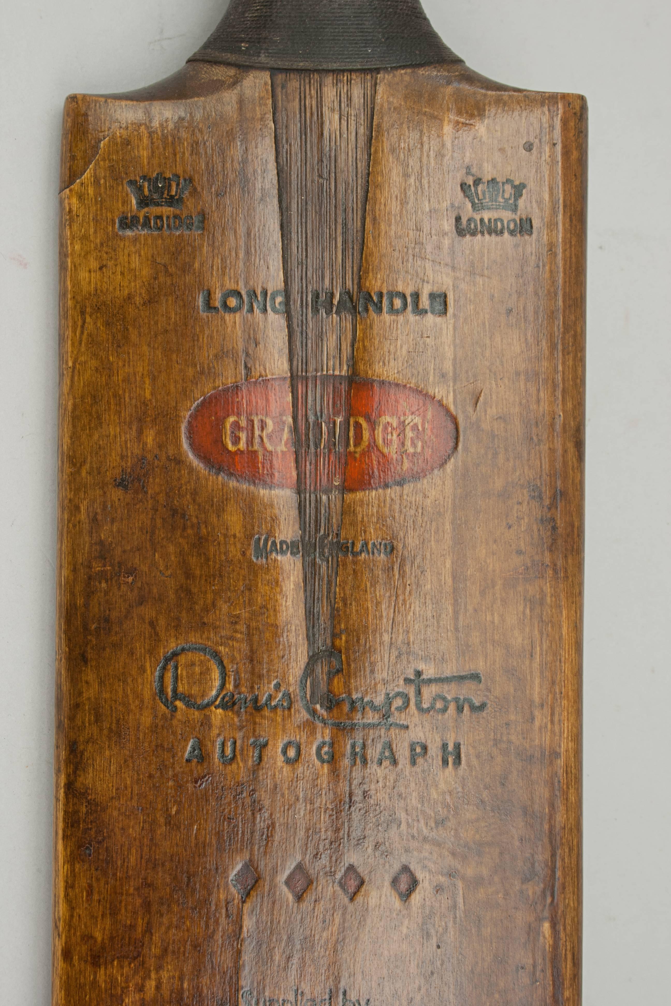 Vintage Gradidge cricket bat.
A good willow cricket bat by Gradidge of London. The 'Denis Compton' autograph bat is in good condition with a lovely dark patina. The blade is embossed with a crown on each shoulder, the words 'Gradidge' under one,