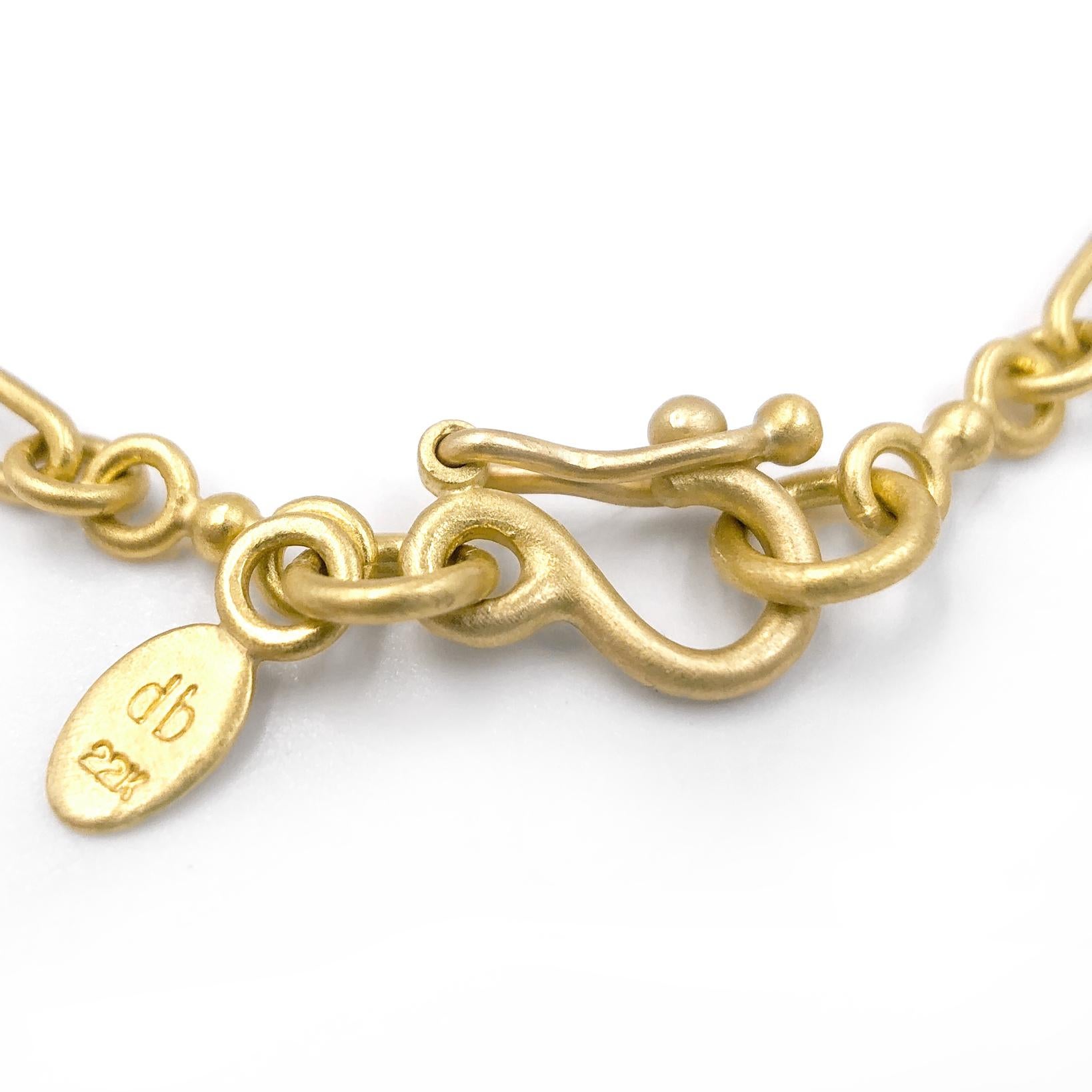 Single Ball Chain Link Bracelet handmade by artisan jeweler Denise Betesh in matte-finished 22k yellow gold and finished with an open cottonwood drop element embedded with a single round brilliant-cut white diamond. Heavy-duty locking 18k/20k yellow