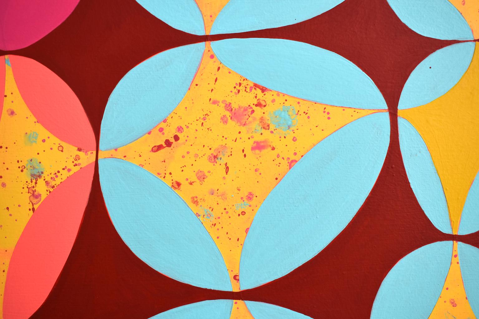Denise Driscoll’s “Confluence 1” is a 30 x 30 inch abstract painting hundreds of small overlapping ovals that are broken into slivers of highly saturated color including orange, blue and green. The surface is a velvety matte, with background and