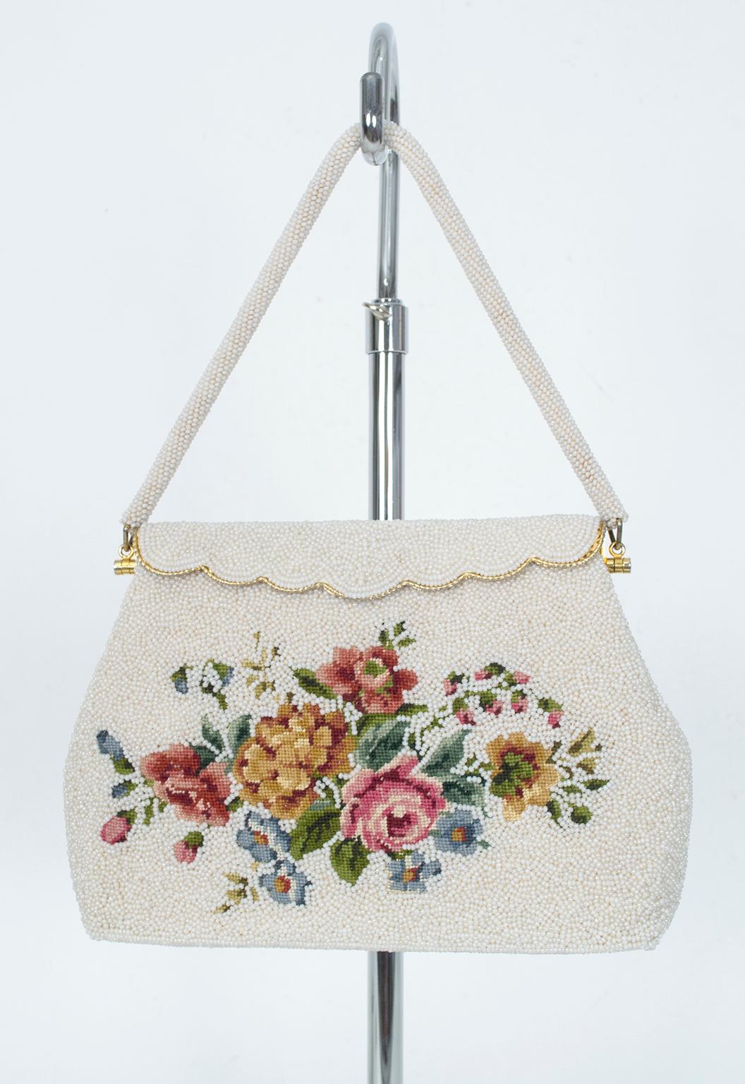 A coveted mid-century combination of both pavé beads AND petit point embroidery, this demure accessory telegraphs French sophistication and patrician breeding. Roomier than most evening bags it features sturdy yet soft construction and a secure