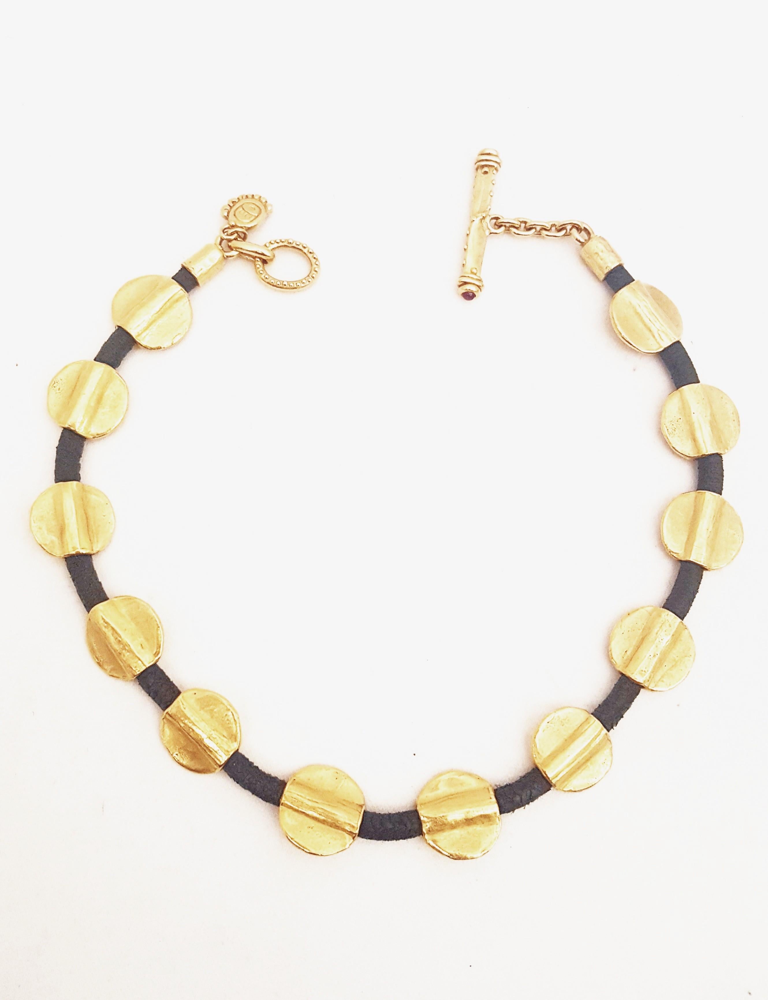 California jewelry designer Denise Roberge creates one of a kind pieces in 22 karat yellow gold using precious and semi precious stones and pearls.  Her 