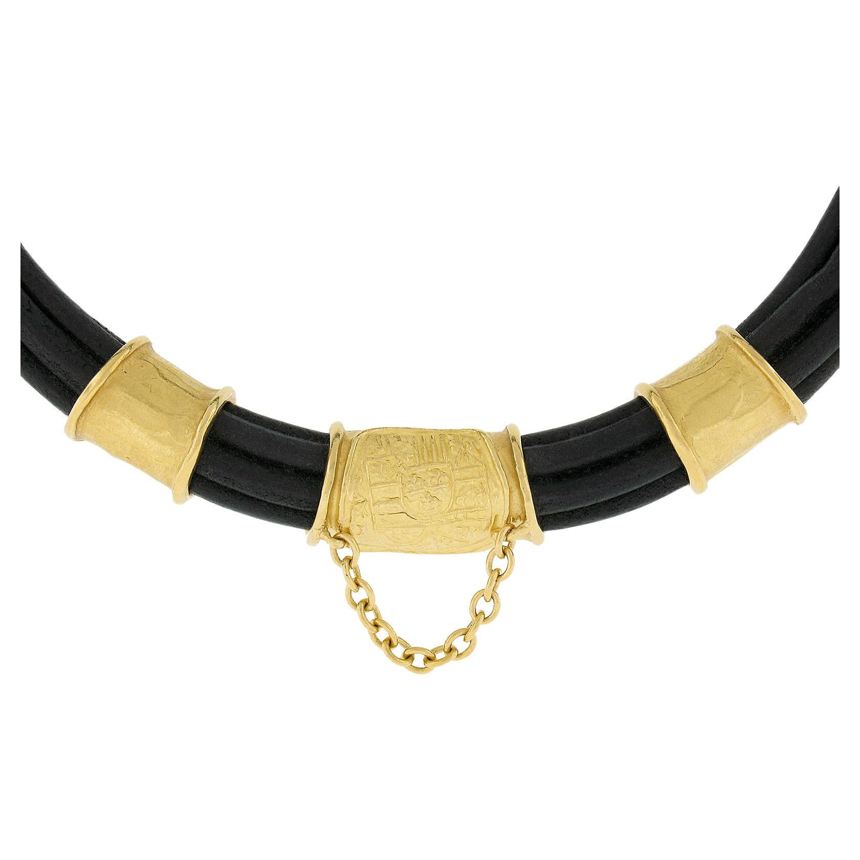 Material: Solid 22k Yellow Gold w/ Black Leather Cord
Weight: 93.6 Grams
Chain Type: Black Leather Multi Cord
Chain Length:	16 Inches (approx.)
Center Piece Width: 30.3mm (1.1