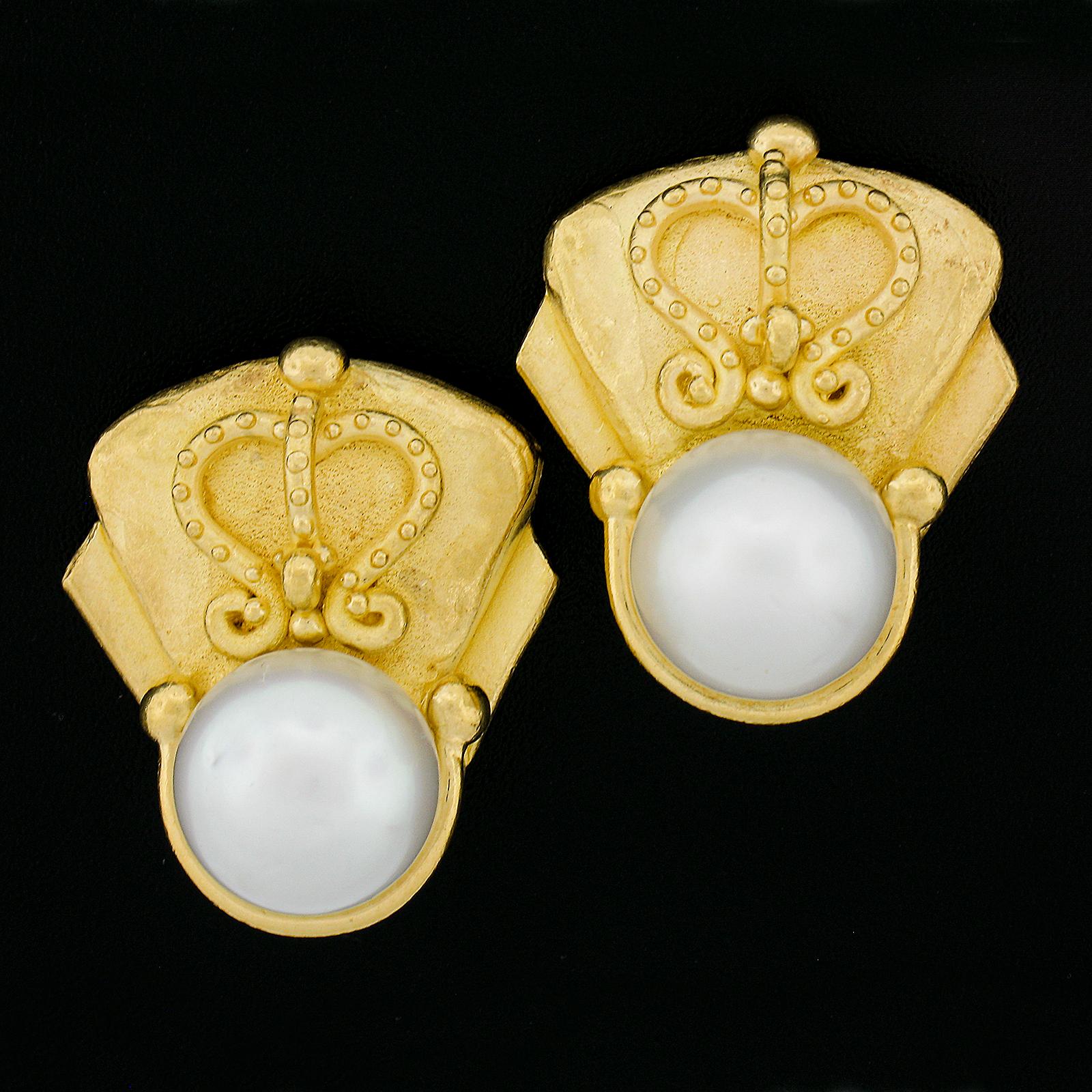 --Stone(s):--
(2) Genuine Cultured South Sea Pearls - Round Shape - White Color - Great Luster - 13.5mm each (approx.)

Material: 22K Solid Yellow Gold 
Weight: 43.39 Grams
Backing:	Clip-On Closures (Pierced ears are Not required. Posts can be added