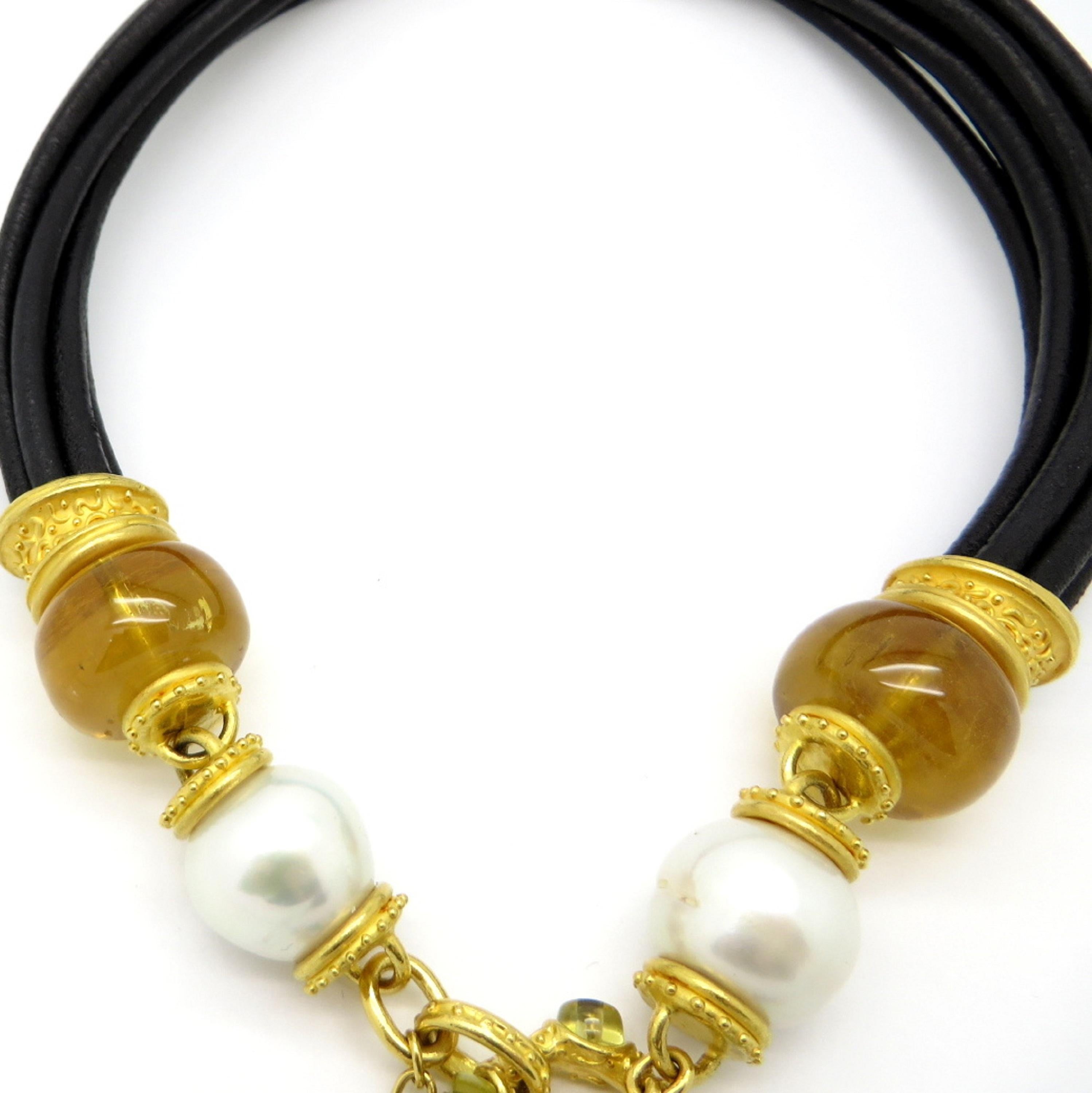 For sale is a designer Denise Roberge necklace crafted with Elephant Hair, Citrine, Pearls, and Peridot!
The necklace measures 18” inches long.  There is a small gold signature charm that is hallmarked: Denise Roberge.
Seven Elephant Hair strands
