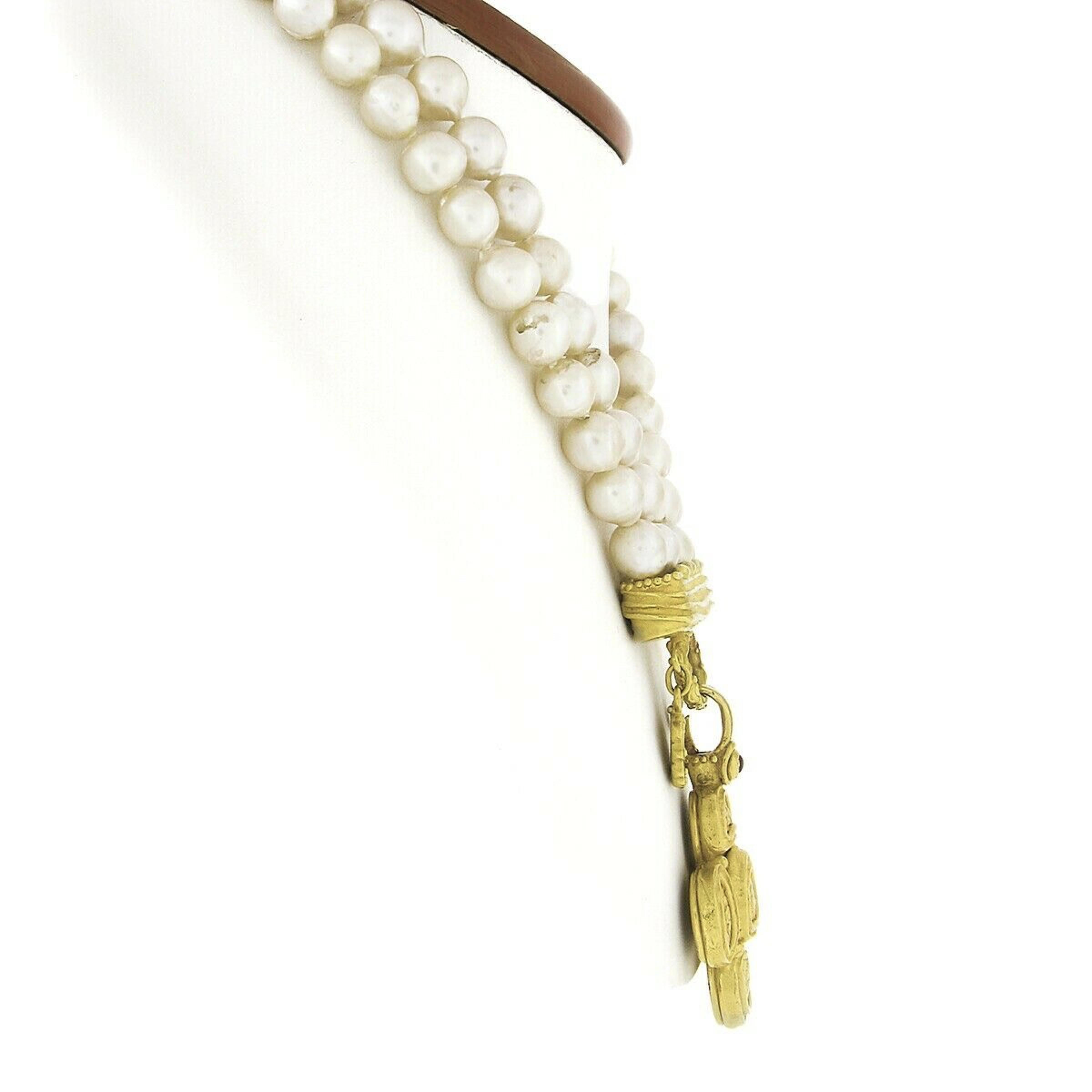 Here we have an absolutely gorgeous statement pendant necklace that is designed by Denise Roberge. This 30 inch dual strand necklace features 147 semi-baroque shape cultured pearls that are very well matched in size at approximately 8-8.5mm each.