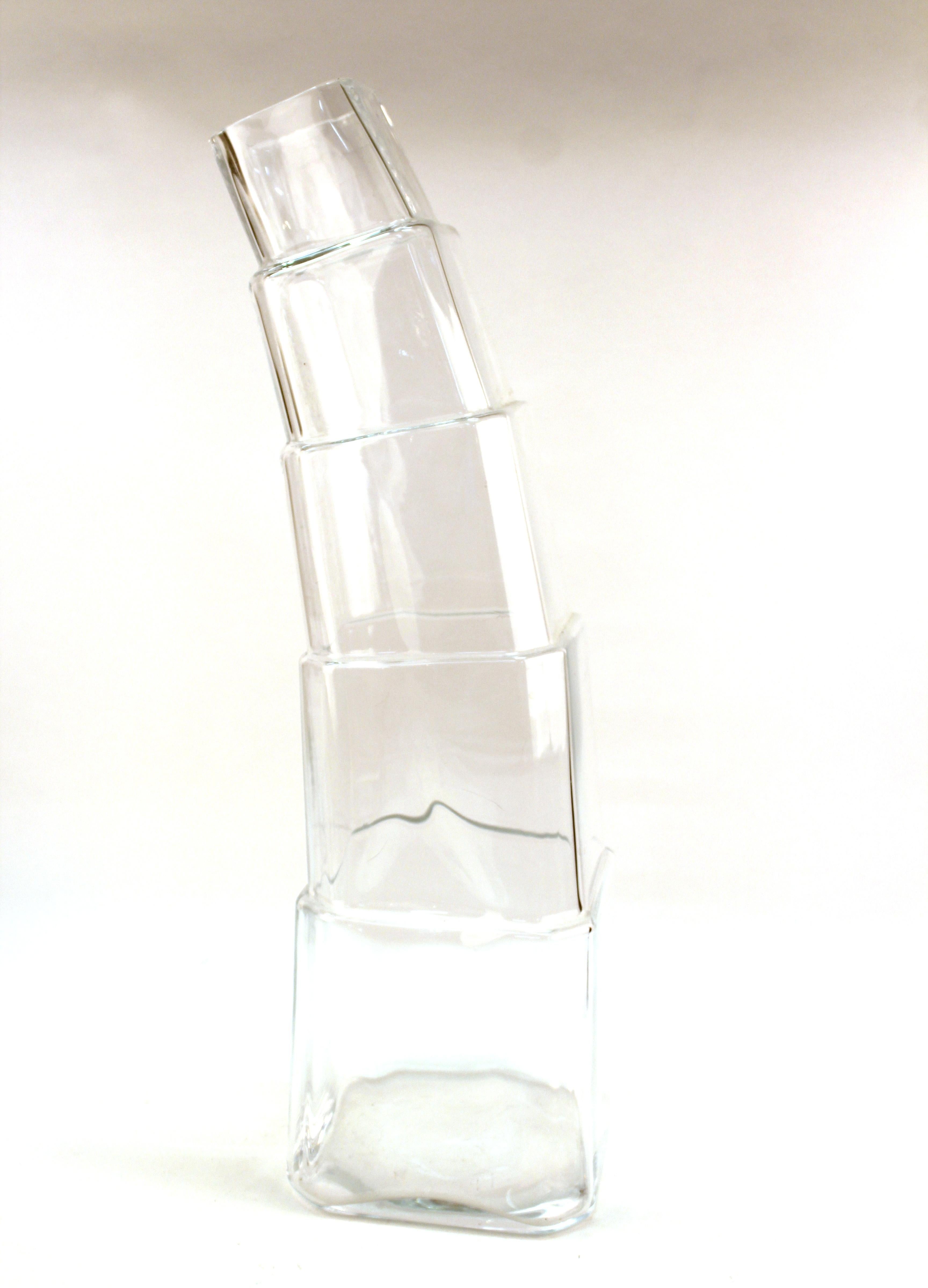 Modern clear glass vase designed by Denizli with stacked elements leaning to one side. Made in the early 21st century. The piece is in great vintage condition with age-appropriate wear and use.