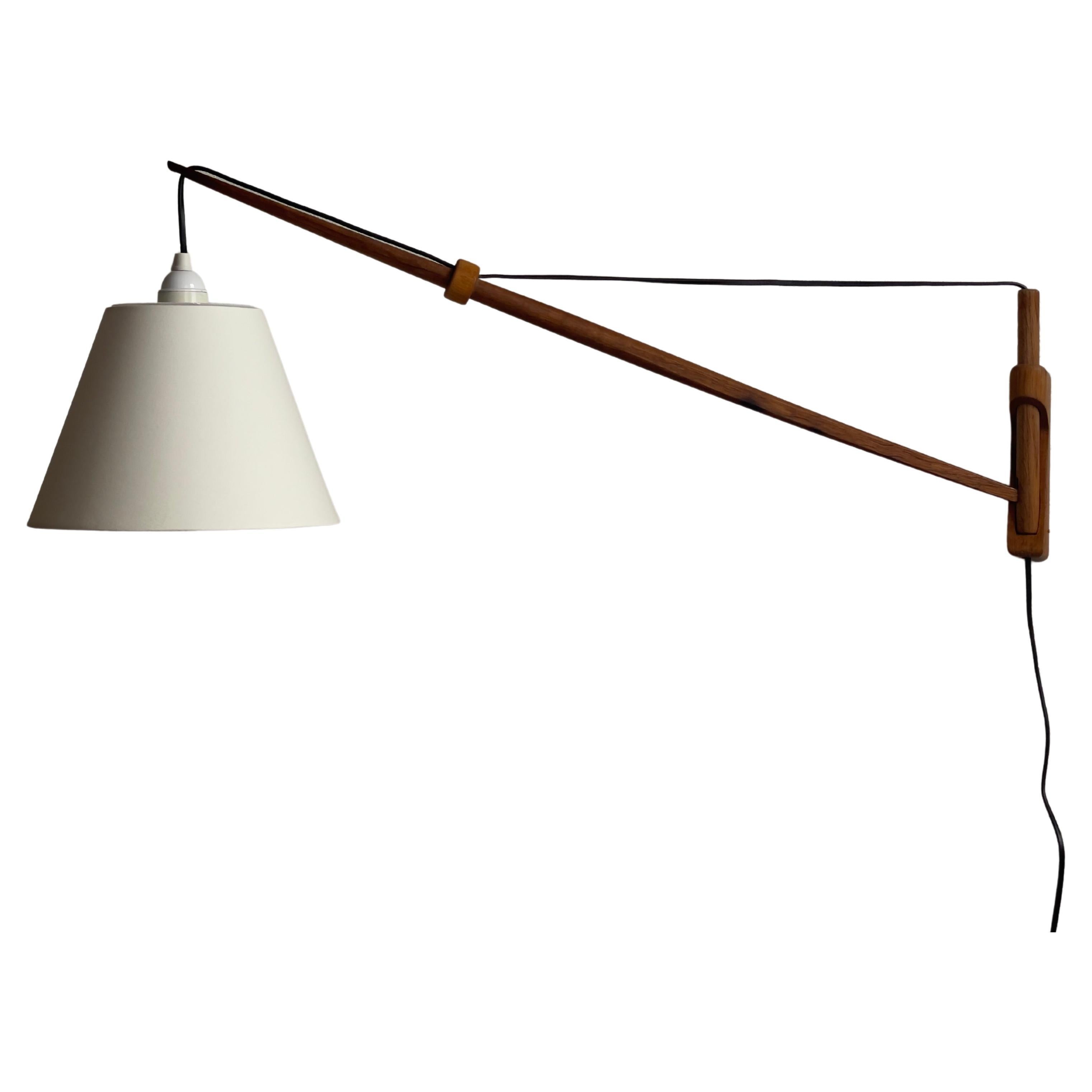 Denmark 1960s danish modern wall lamp/pendant in solid oak with new linen shade. For Sale