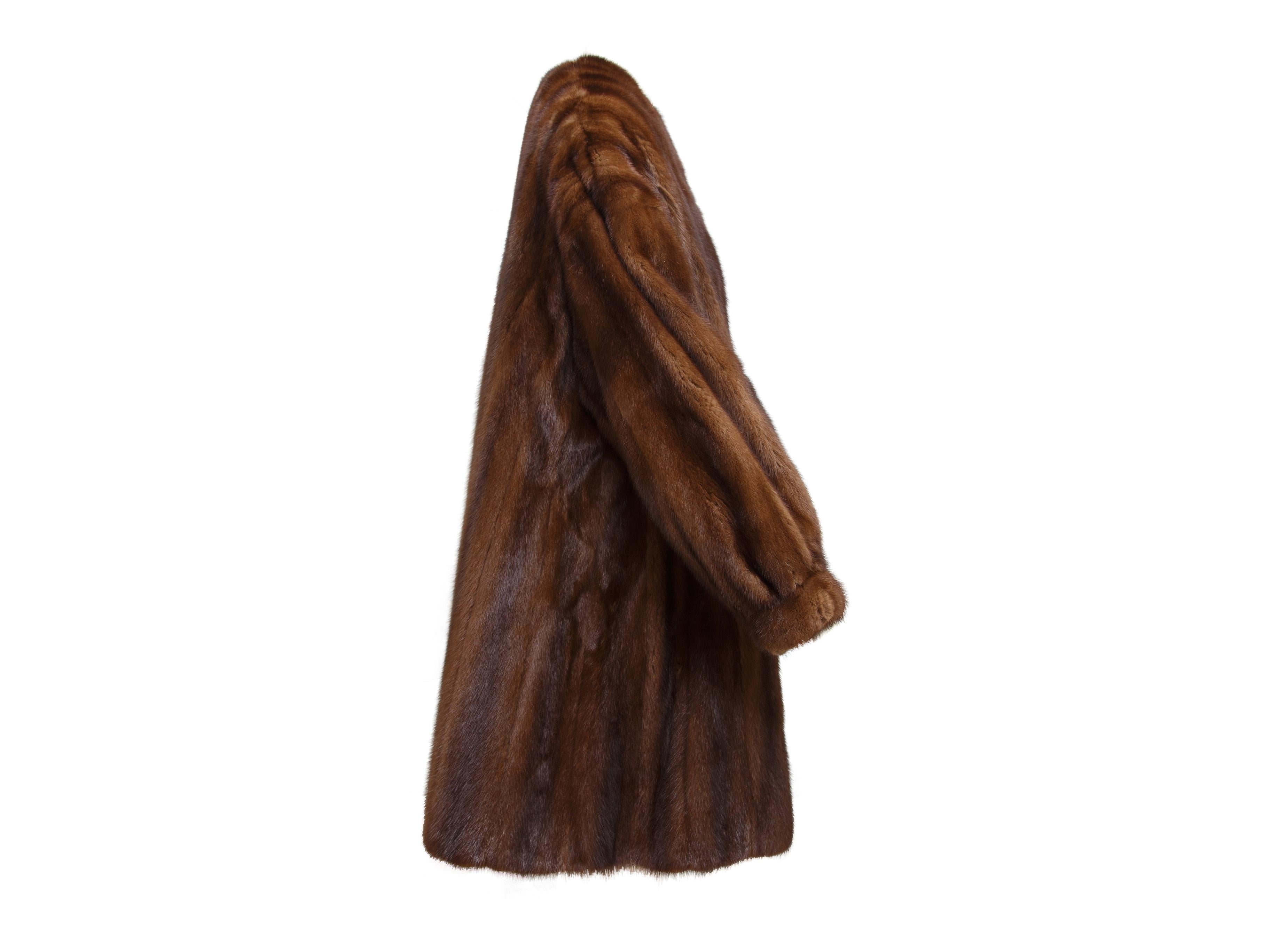 Product details:  Brown Dennis Basso Mink 3/4 Swing Coat. Luxuriously soft and warm, this Dennis Basso mink swing coat has a v-neckline with a large one button closure, and long cuffed sleeves.  26.5