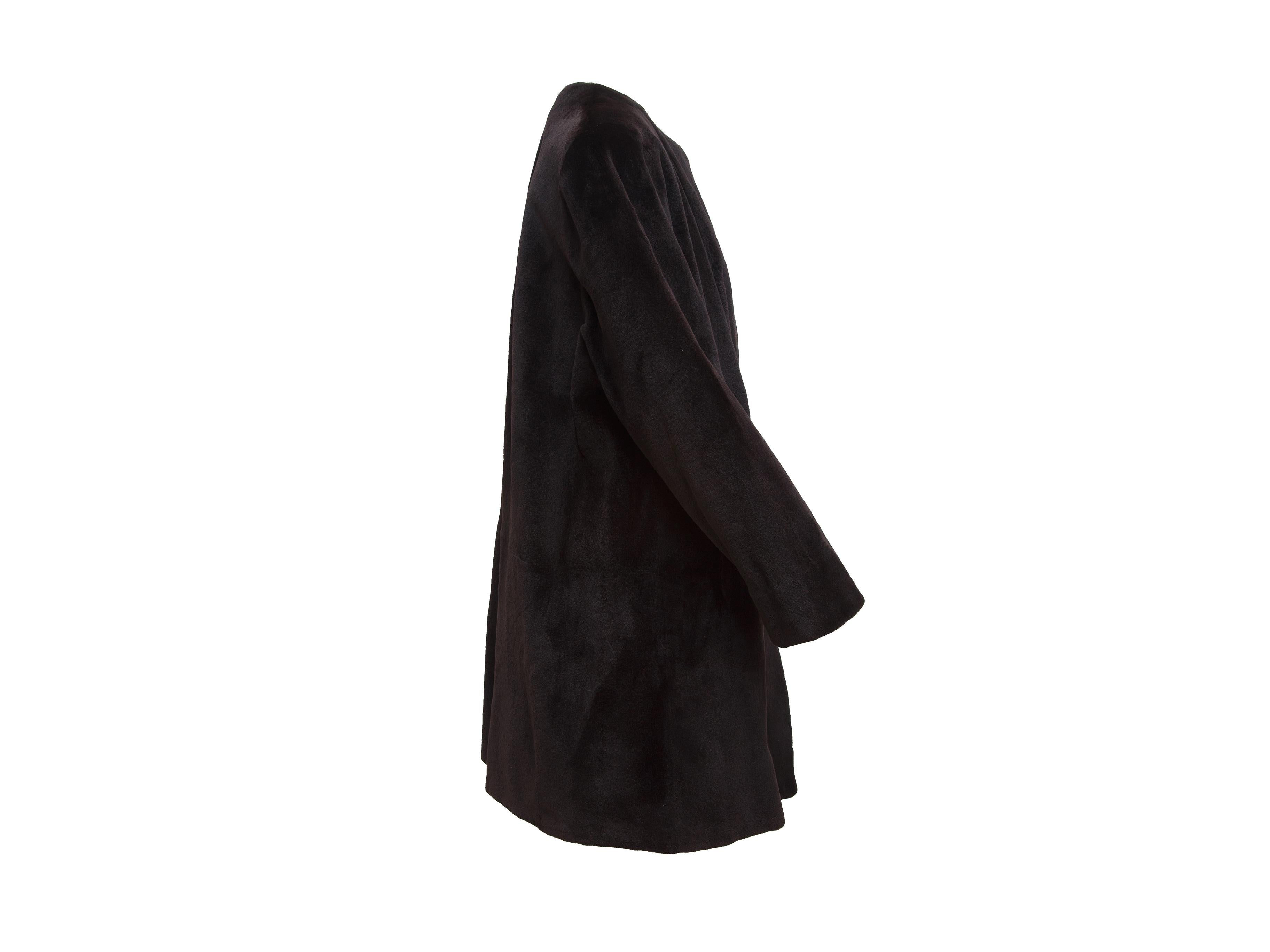 Product details:  Chocolate Brown Dennis Basso Sheared Mink 3/4  Coat. Luxuriously soft and warm, this Dennis Basso sheared mink coat in rich chocolate brown, has a round, collarless neckline, hook and eye closures, and long sleeves.  24.5