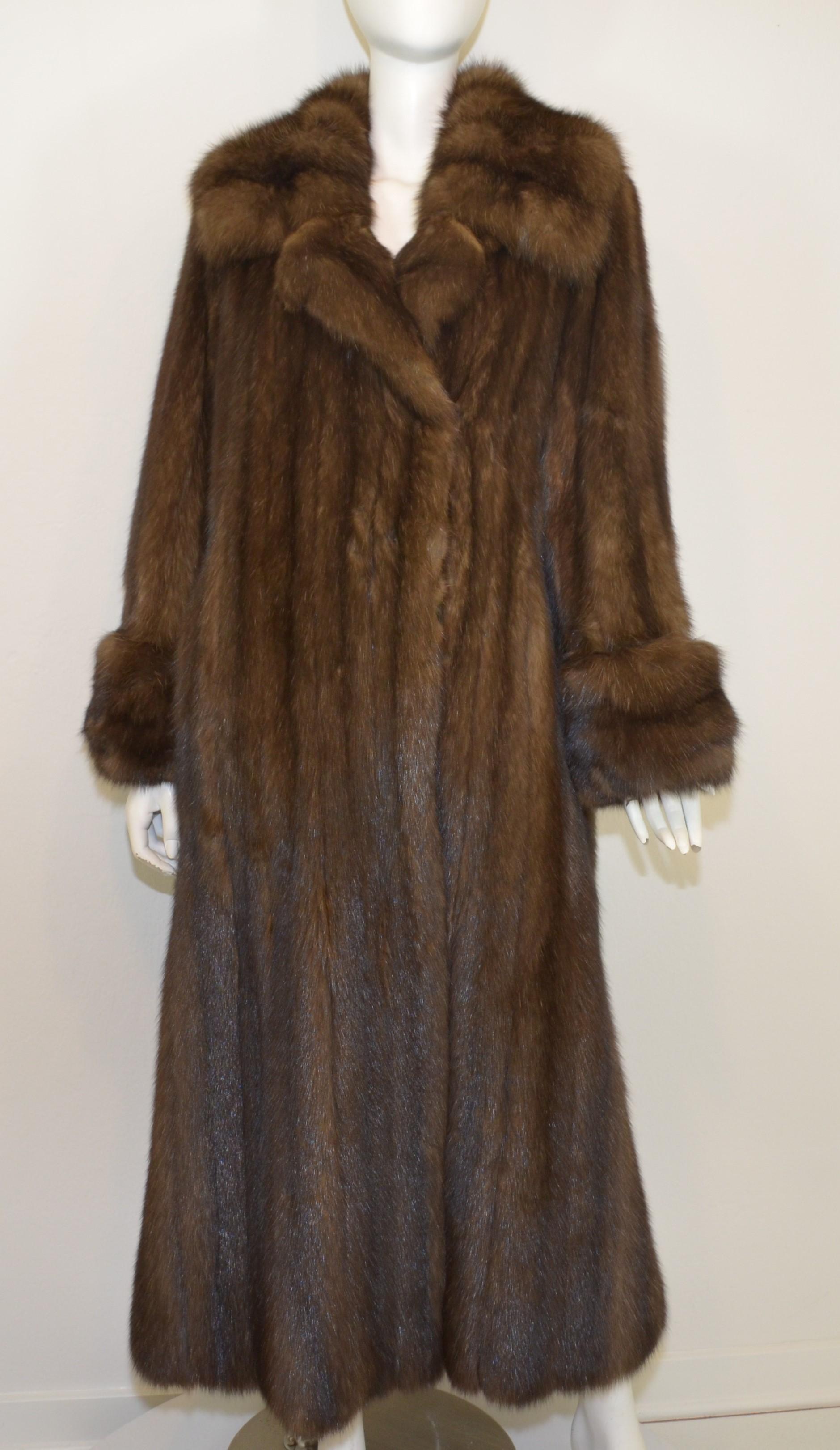 Dennis Basso sable fur coat -- Fully lined, pockets at the waist, and Two hook and eye fastenings.

Measurements:
bust 44”
waist 42”
sleeves 26”
length 55”