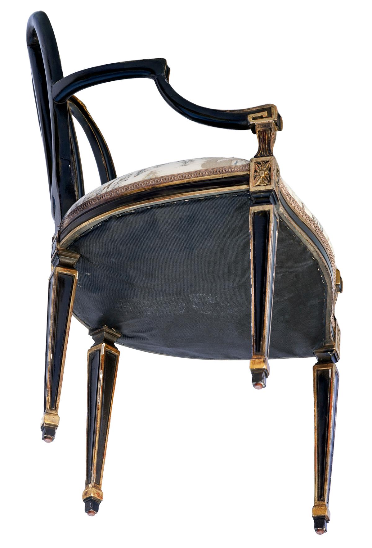 American Dennis & Leen Ebonized and Parcel-Gilt Bracelet Armchairs; a pair