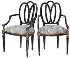 Dennis & Leen Ebonized and Parcel-Gilt Bracelet Armchairs; a pair