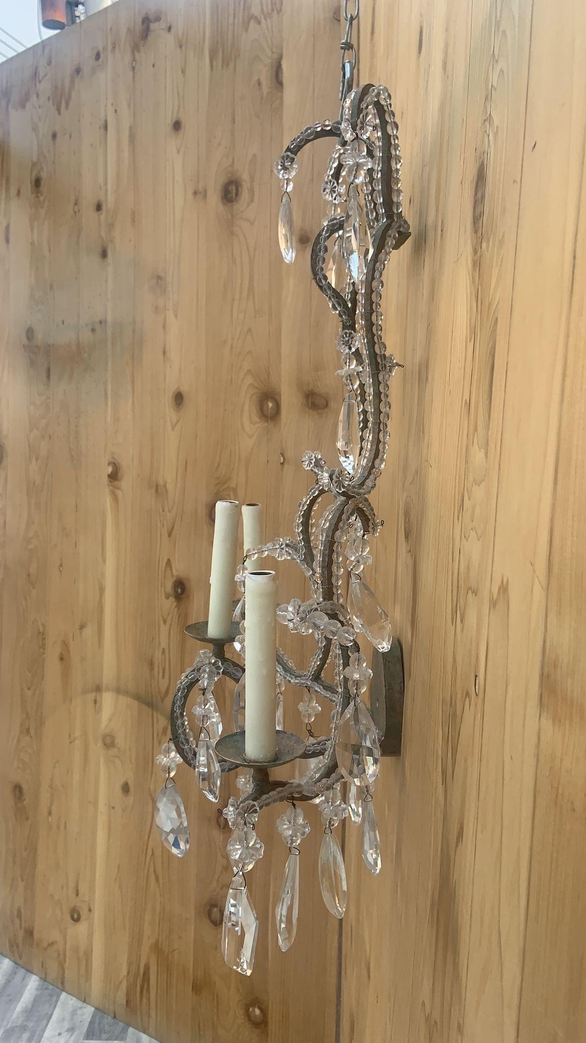 Vintage Dennis & Leen French Louis XIV Styled Large Iron & Crystal Beaded 3 Light Wall Sconces - Pair 

Striking pair of vintage Dennis & Leen French Louis XVI Styled Iron & Crystal Wall Sconces will be an amazing addition to Hollywood Regency or