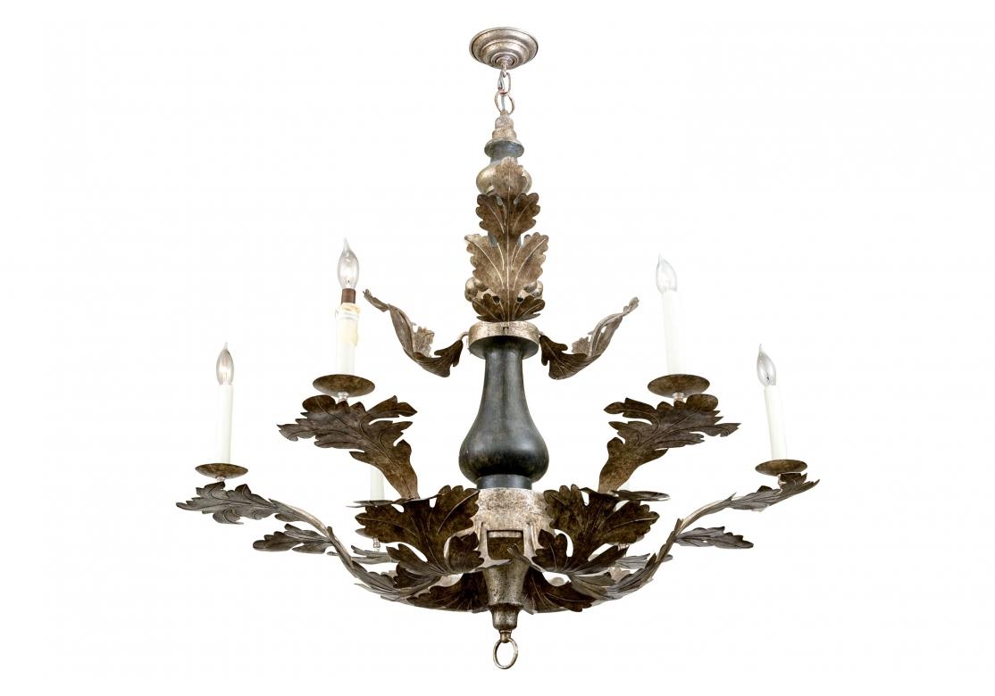 Dennis & Leen large ebonized and silvery/gilt wood standard emitting branches of tole foliate motifs and 6 lights with wax candle covers. Comes with a ring pull terminal, short 2 link chain and ceiling plate.
Dimensions: 42 1/2