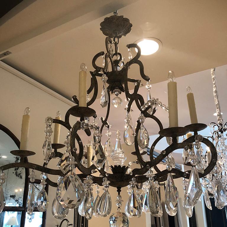 Grand crystal chandelier by Dennis & Leen. In a lovely bronze iron color. A beautiful statement piece for any room in a home. The perfect piece to have installed before the holidays!

Measures: 34