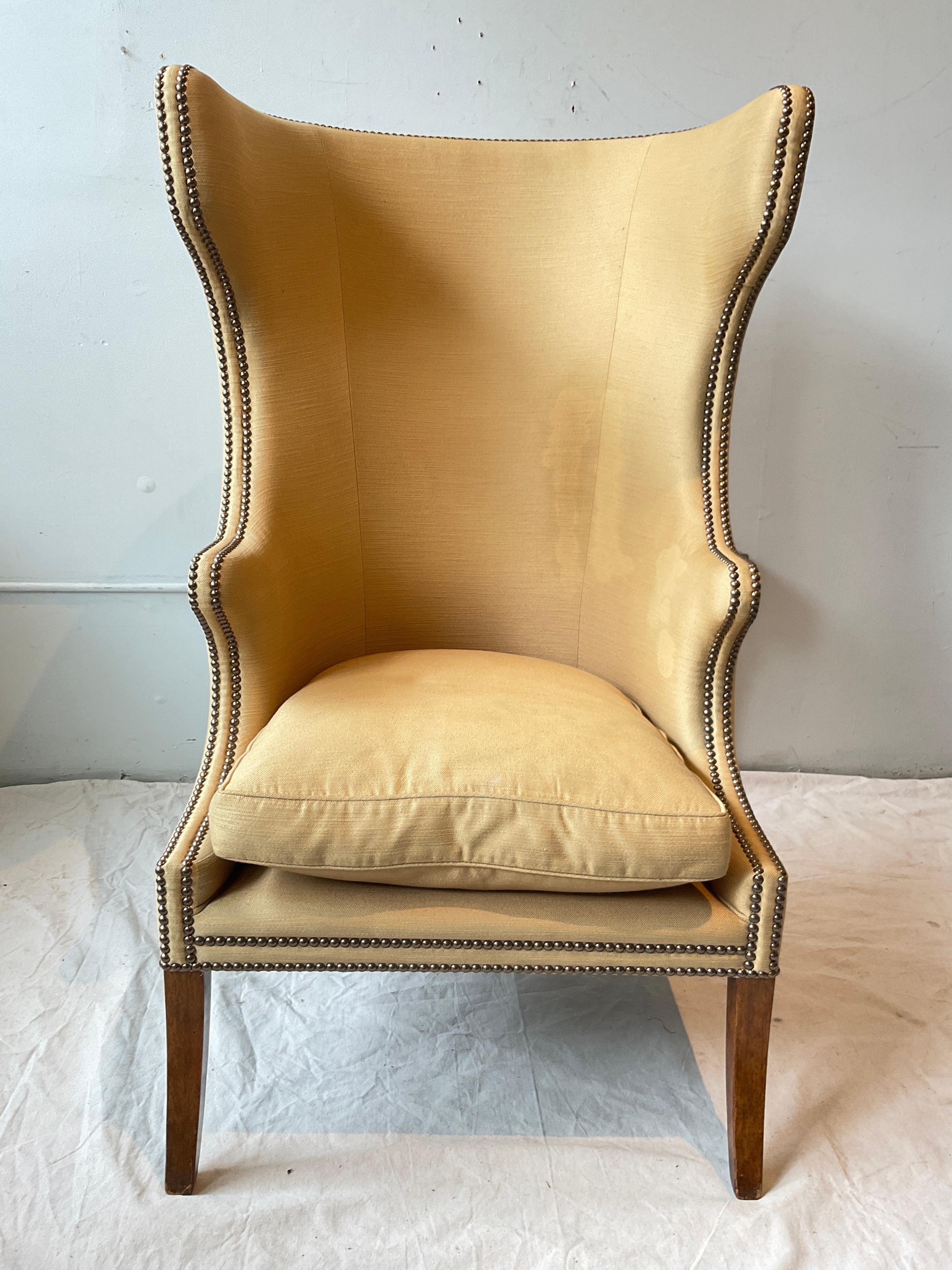Dennis & Leen wingback chair. Stains on fabric, on back, and on front as seen in image 8. Needs reupholstring.
