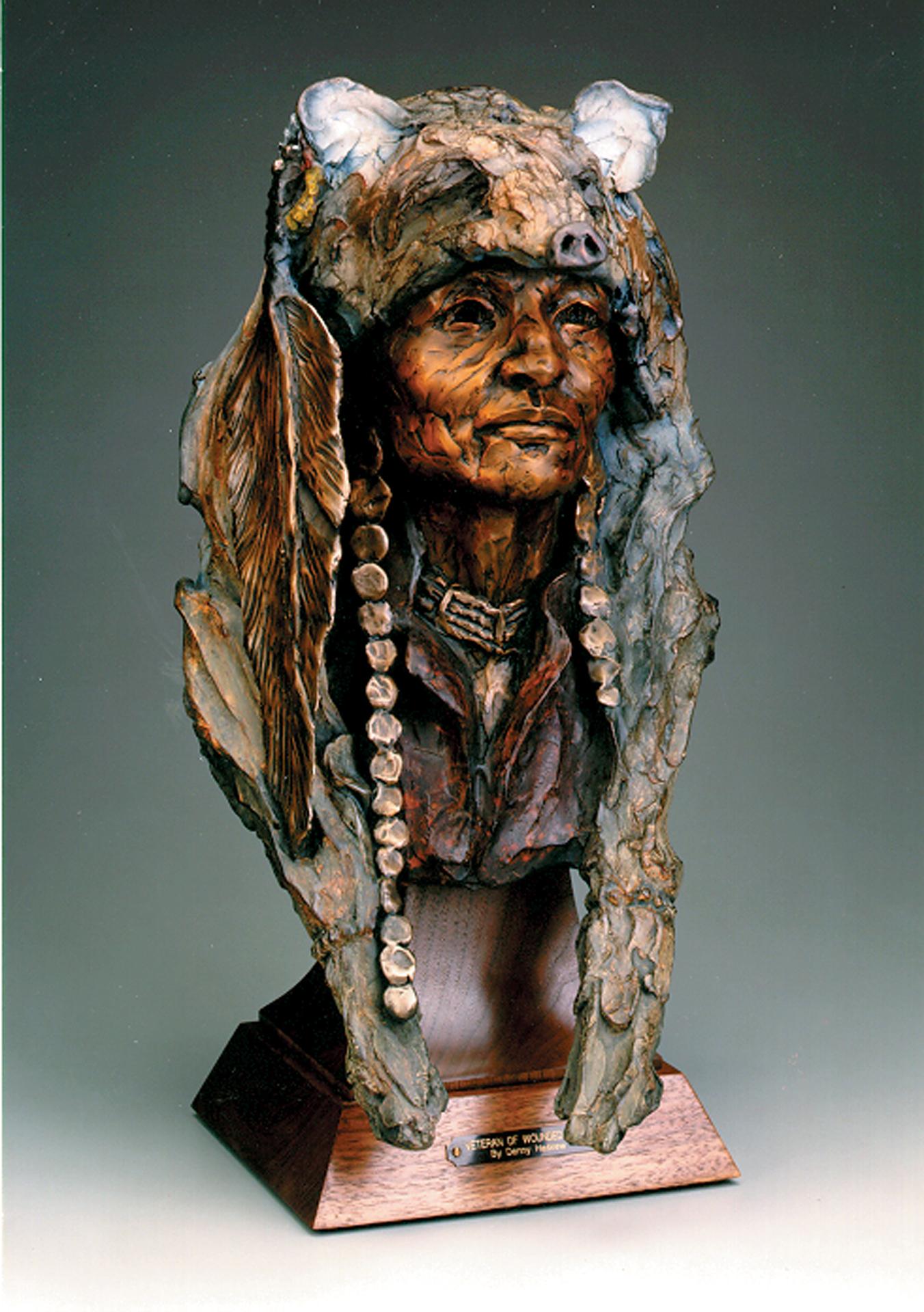 "Veteran of Wounded Knee" by Denny Haskew 
Figurative Bronze Bust of a Native American
10.5x23.5x19" Ed/20

"Proud Man look this way
coyote sittin on your head,
good for foolin the soldiers.
Proud Man ya got scars,
bet yur face seen a gun butt 
Hey,