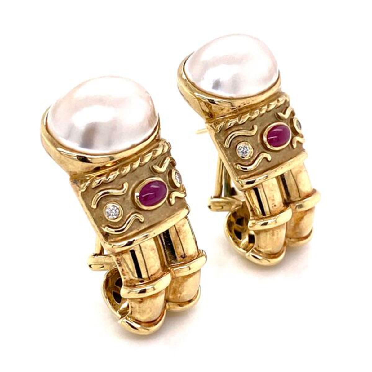 Awesome and finely detailed Iconic DENOIR Clip Earrings. Each earring set with a Pearl, Rubies and Diamonds, approx. 0.10 total carat weight. Hand crafted in 14 Karat Gold and Signed: DENOIR 585. The earrings are in excellent condition and were