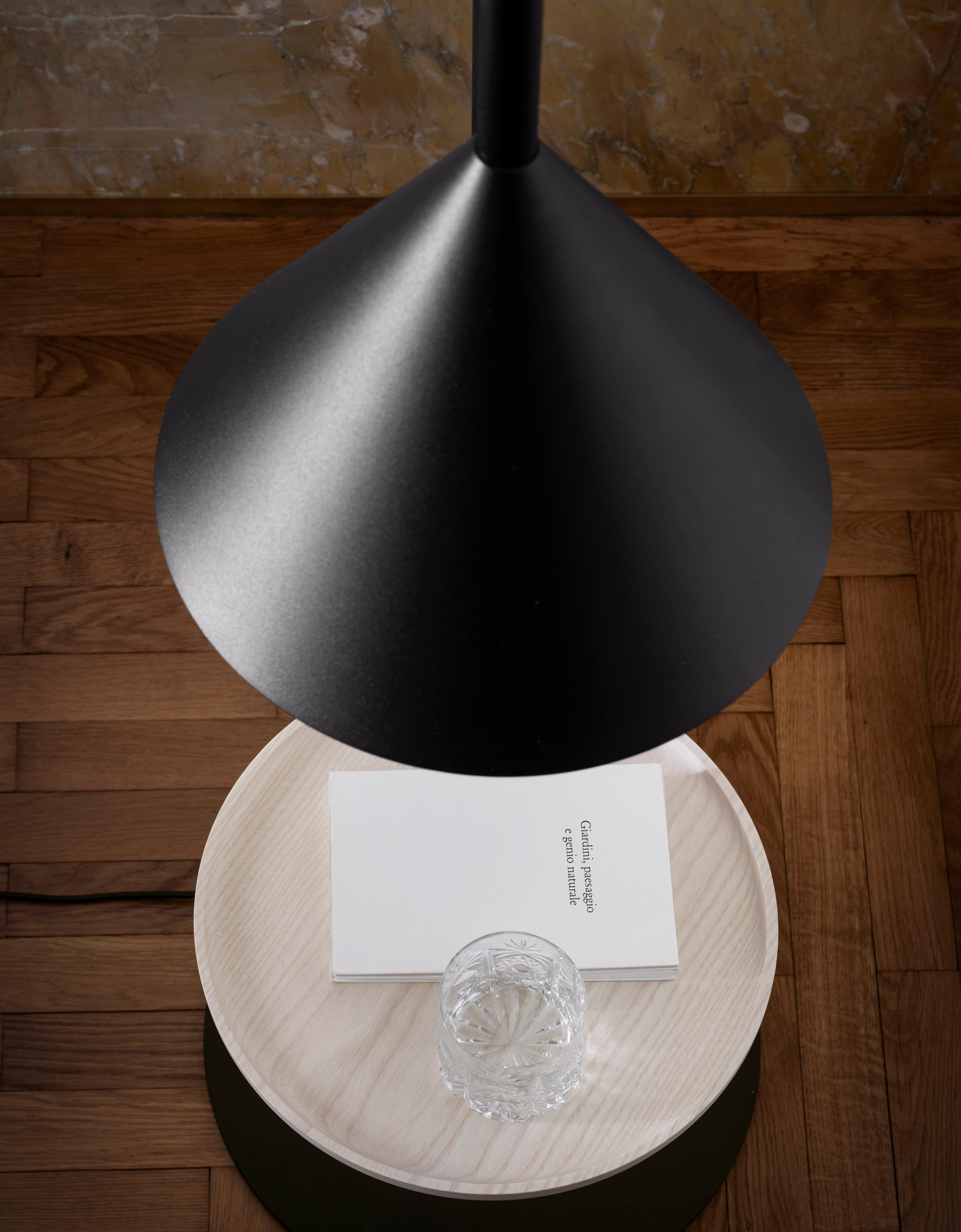The Dent large lamp is made out of ceramic and a solid wood beech insert. The available colors are window grey, intense blue, jade and beige-
red. The shown large suspended ceramic Dent lamp is in the size 30 x 19 x 56 H. 
 
 Born in Croatia to