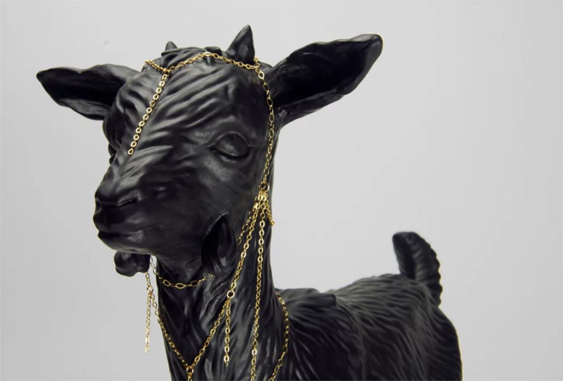 Dephi is a dreamlike slip-cast porcelain goat sculpture with a matte black glaze and gold filled chain adornment, and is part of the The Lost Camp's BLACK APOLLO ISLAND SERIES. 

Ethan Kruszka and Mikel Durlam have created The Lost Camp as a