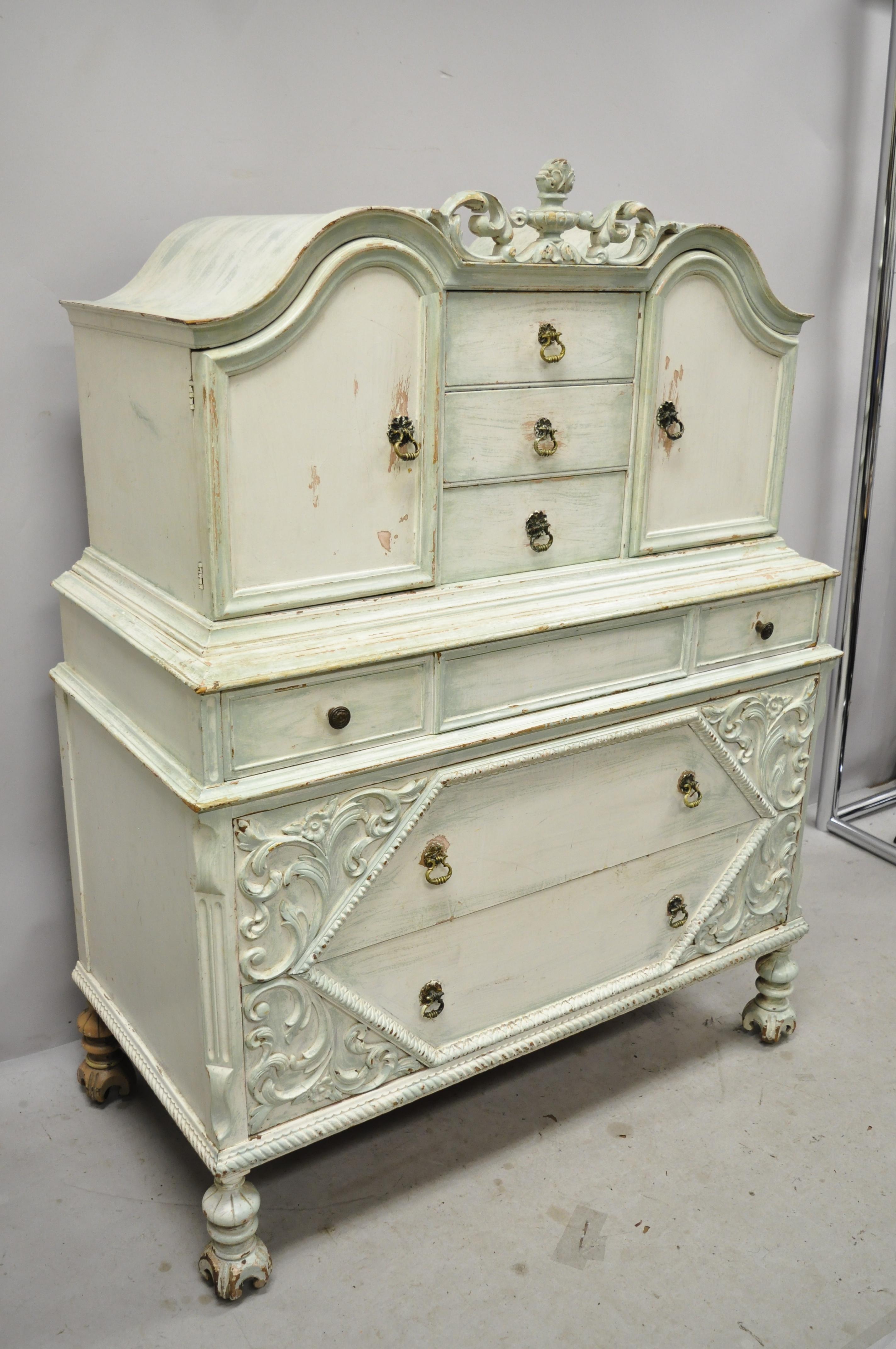 Antique depression Renaissance bonnet top blue white distress painted dresser chest armoire. Item features rolling casters, urn carved pediment, blue/white distressed finish, 2 swing doors, 6 dovetailed drawers, solid brass hardware, very nice