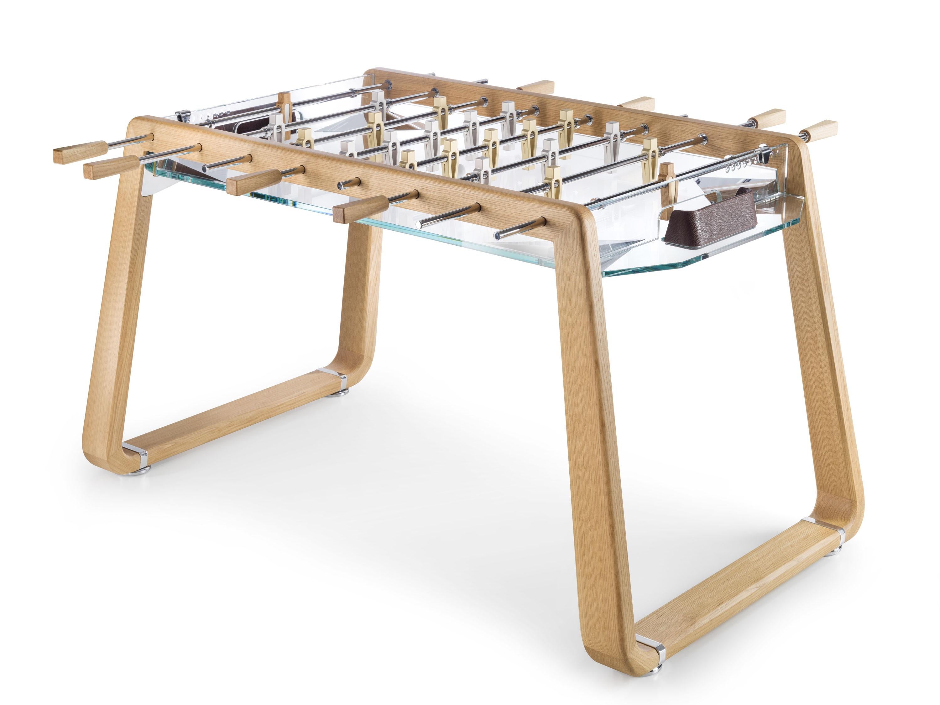 Derby di Milano Natural Oak Foosball by Impatia
Dimensions: D153.2 x W88.5 x H85.8 cm
Weight: 160 kg
Material: Wood structure,Glass playing field,Chrome finished metal components,Anodised aluminum players,Leather.
Also Available: Different