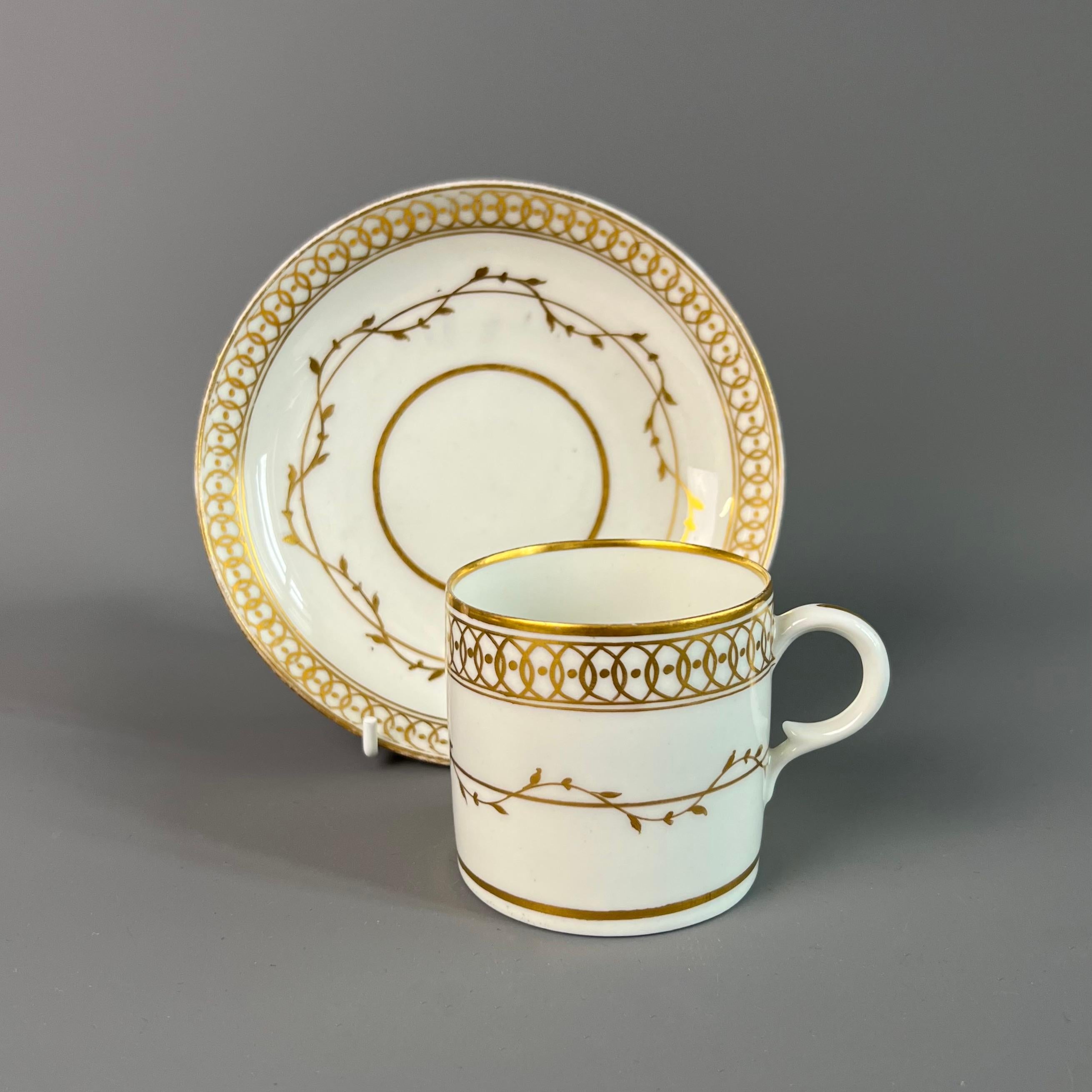 This is a beautiful coffee can with saucer made by Derby in about 1795. The can has a simple but sophisticated gilt pattern on a white ground.

The Derby Porcelain factory has its roots in the late 1740s, when André Planché, a Walloon Huguenot