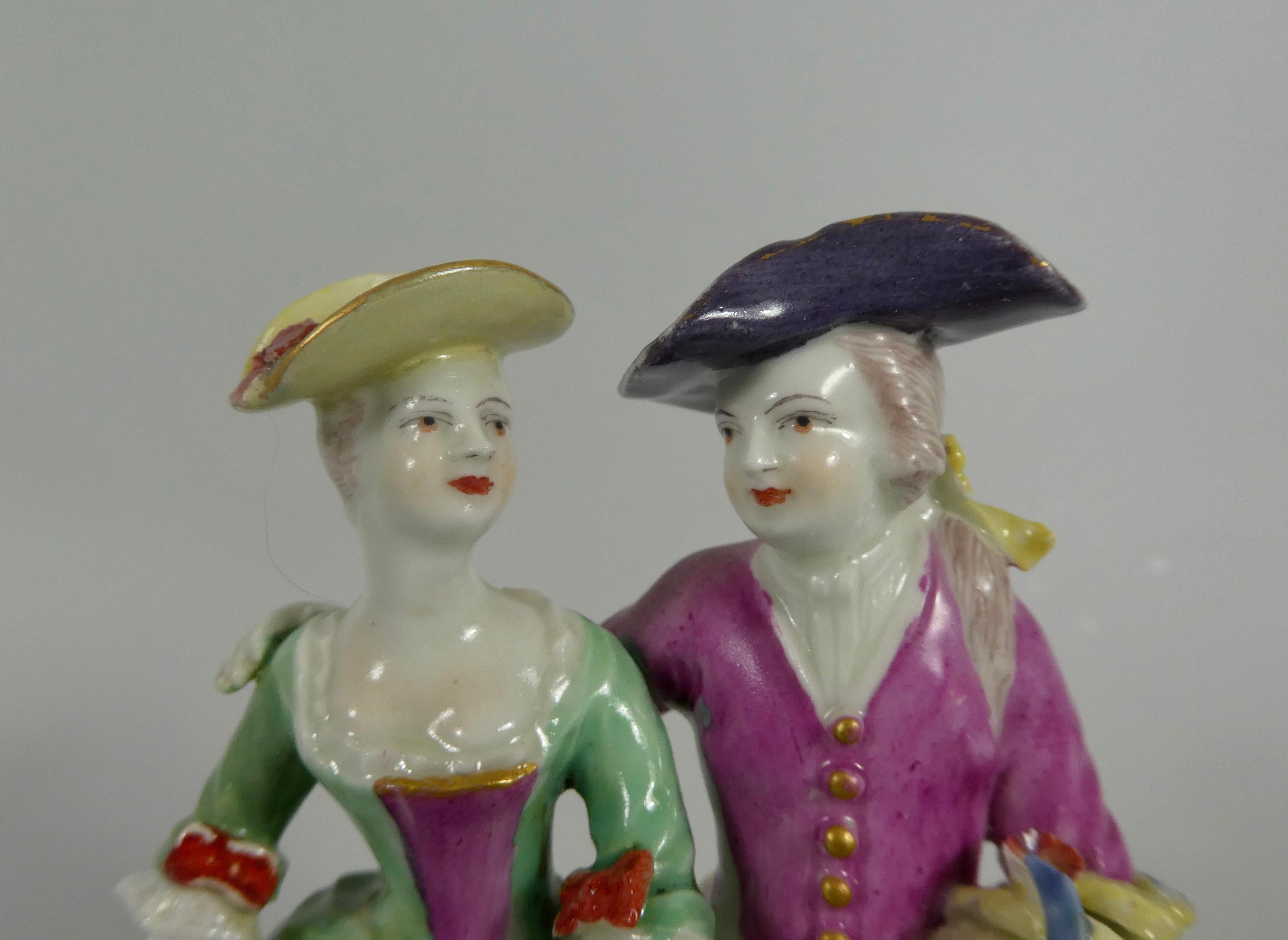A fine Derby Porcelain group, circa 1765. Representing ‘Summer’ from the four seasons, the group beautifully modelled as a courting couple, in 18th century attire. The man carries a sickle and wheat sheafs, whilst his companion carries flowers. A