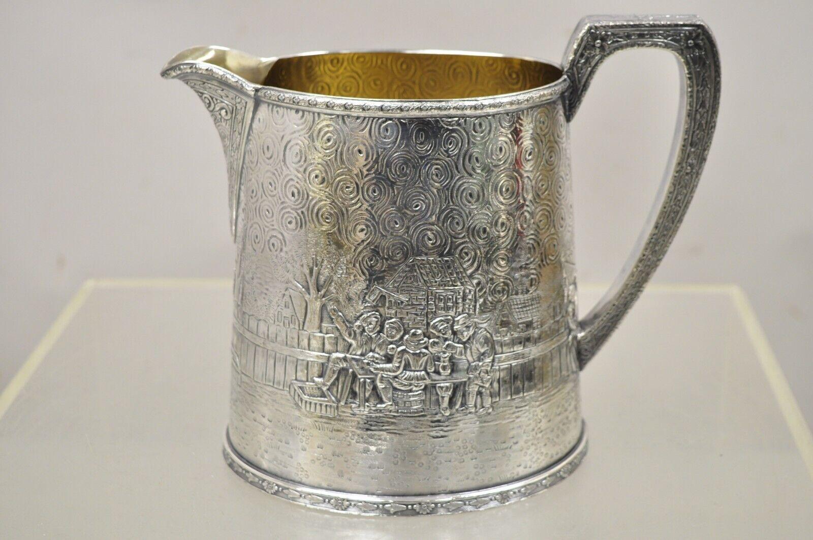 Derby S.P. Co International Figural Repousse Village Silverplate Water Pitcher For Sale 4