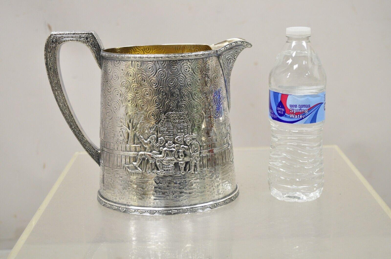 Derby S.P. Co International Figural Repousse Village Silverplate Water Pitcher For Sale 1