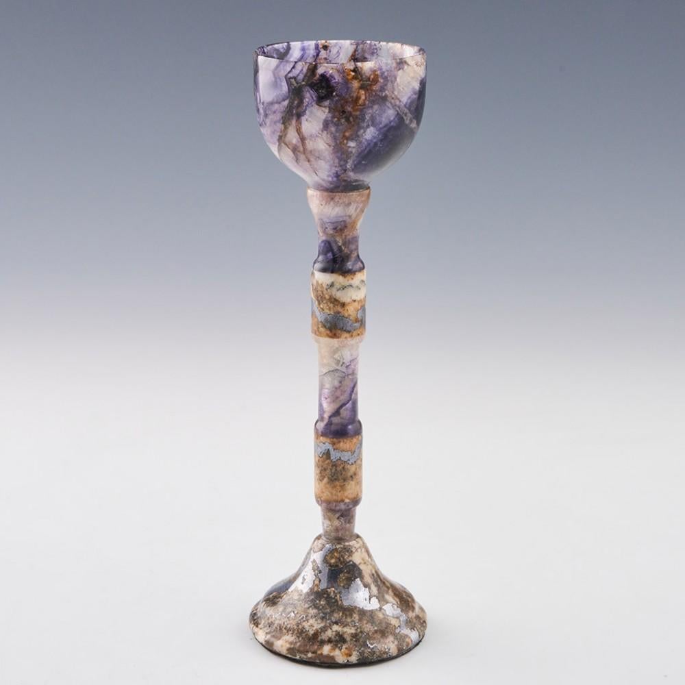 Heading : Derbyshire Fluorspar Blue John Chalice
Period : Elizabeth II - late 20th century
Origin : Derbyshire
Colour : Blue, cream,pale brown, silver and silver grey
Bowl : Cup shaped made of Old Tor Vein
Stem : Two cylinder knops also from