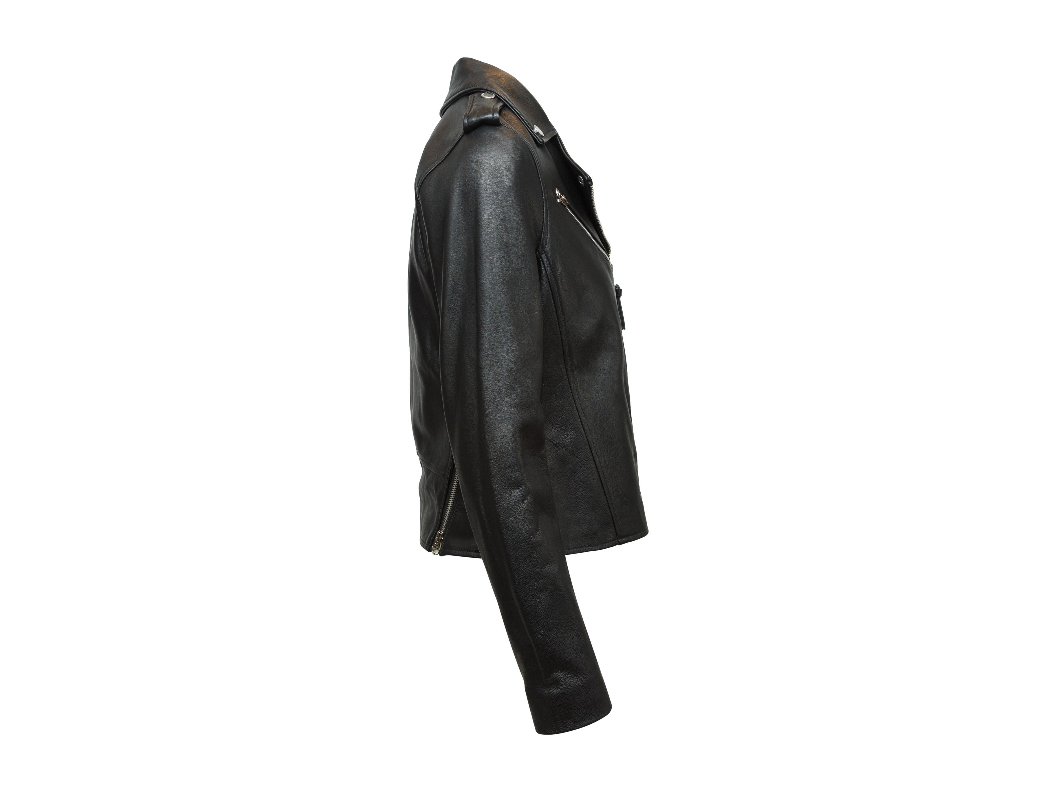 Product details: Black leather moto jacket by Derek Lam 10 Crosby. Silver-tone hardware. Notched lapel. Zip closure at front. 31