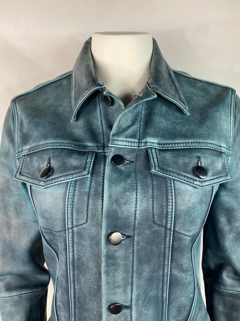 Product details:

The jacket is made out of 100% genuine lambskin in ocean blue/ turquoise color. It features collar, front button closure and front dual pockets w/ button closure.
Made in USA.