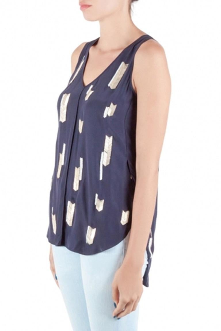 This sleeveless top from Derek Lam 10 Crosby is perfect to complement your chic style! The top is made of silk and features embellishments all over. It flaunts a V neckline and a high low hem. Pair it with denim and ballet flats for a casual day out.