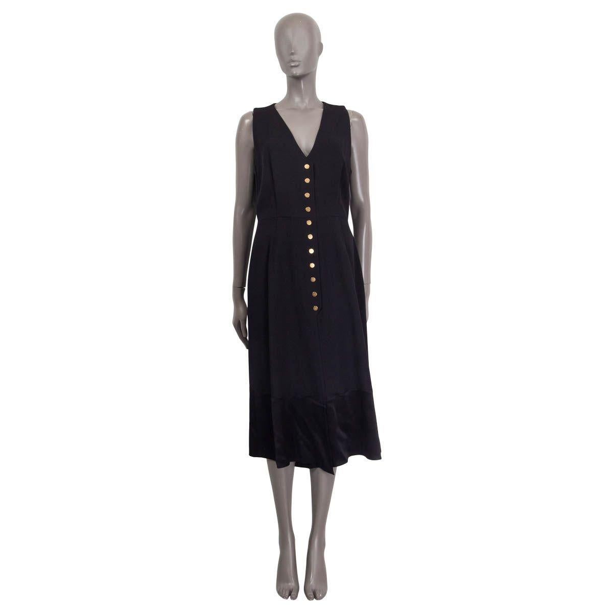 100% authentic Derek Lam asymmetrical midi dress in black acetate (53%) and viscose (47%). Features a black silk (100%) hemline and a deep v-neck. Opens with a concealed zipper and a hook on the back. Lined in black silk (100%). Has been worn and is