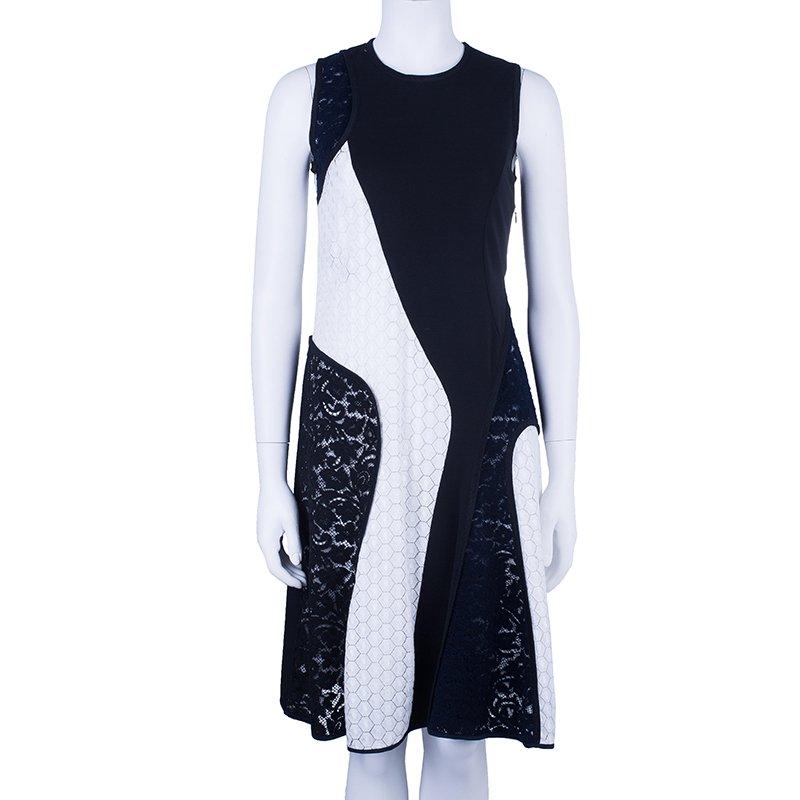 This Derek Lam Paneled Dress is simply a bold beauty. Made from viscose blend it is uniquely designed with rich lace, self designed fabric and plain crepe panels. The sleeveless beauty features a round neckline, slightly loose bodice and flowing A