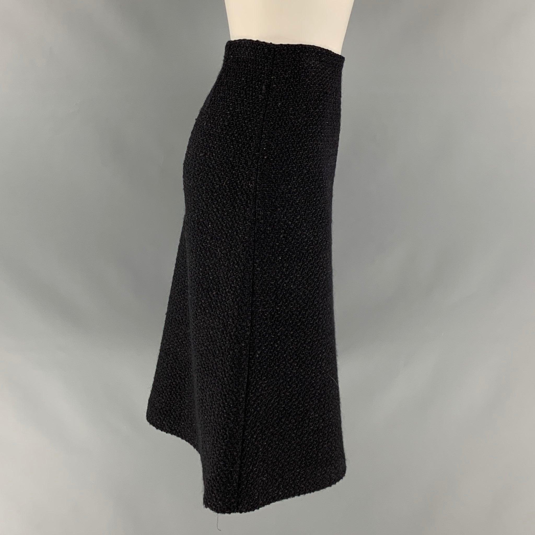 DEREK LAM skirt comes in a black textured boucle featuring a pencil style and a side zip up closure.
 Very Good Pre-Owned Condition. 

Marked:   no size marked 

Measurements: 
  Waist: 30 inches  Hip: 36 inches  Length: 25 inches  
  
  

