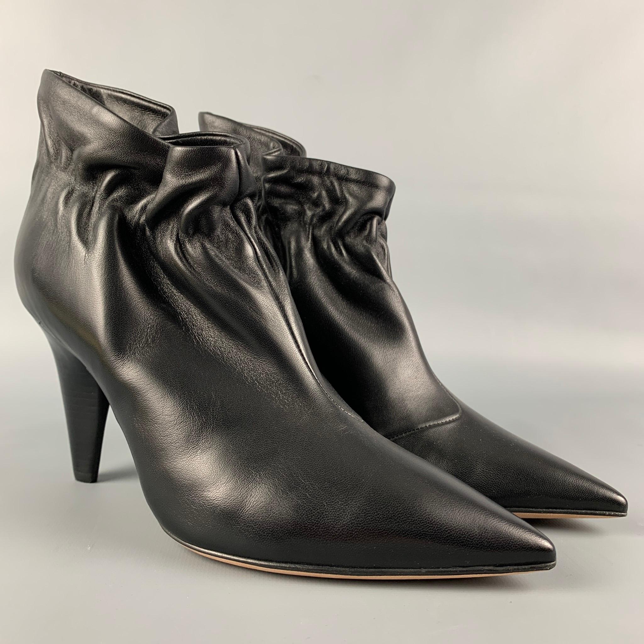 DEREK LAM boots comes in a black leather featuring a ruched style, pointed toe, and a stacked heel. Handmade in Italy.

New Without Tags. 
Marked: 37.5 in.
Original Retail Price: $795.00

Measurements:

Heel: 4 in. 