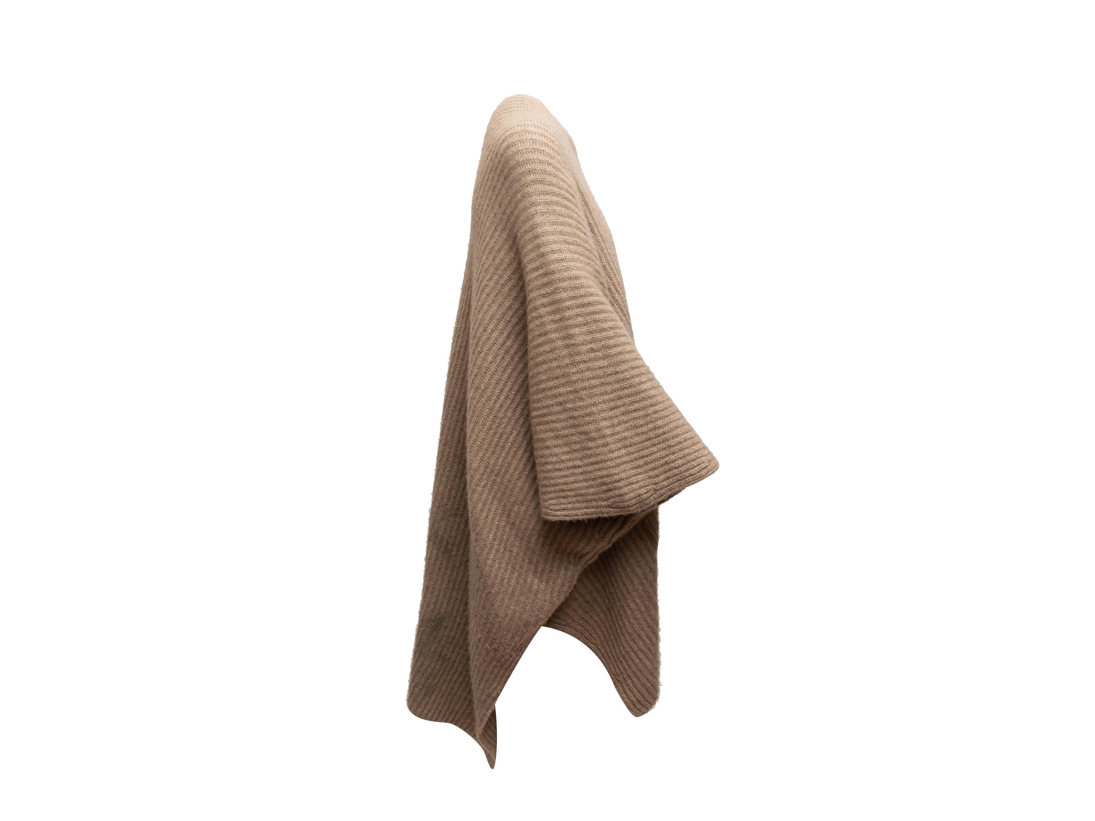 Product details: Tan oversized ribbed cashmere poncho by Derek Lam. V-neck. Dual patch pockets. Zip closure at center front. 49