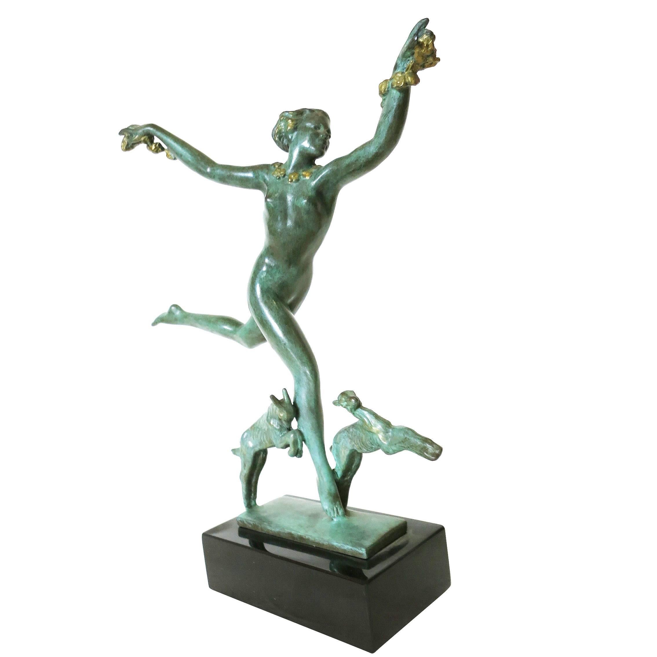 Art Deco style solid bronze casting with an antique green patina finish of a nude female nymph dancing standing on a mirror polished black marble base.

Product handcrafted in the USA with the highest quality materials and over 30 years of