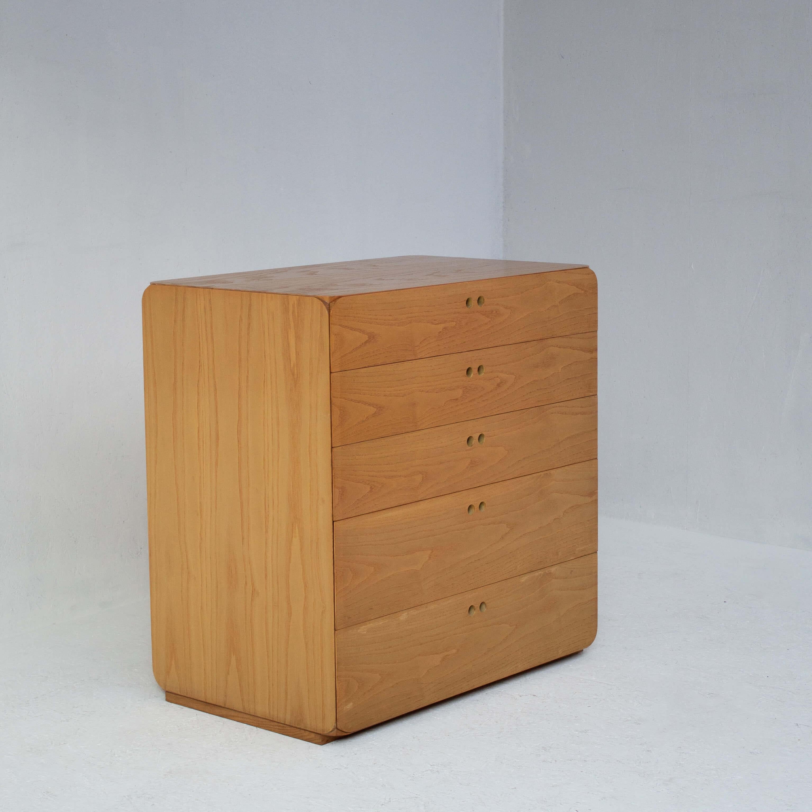 Derk Jan De Vries Samara Chest of Drawers, 1970s. This mid-century modern storage unit features clean lines and smooth surfaces, embodying the functional yet elegant style of the era. Crafted from warm-toned wood, it boasts five drawers, one of