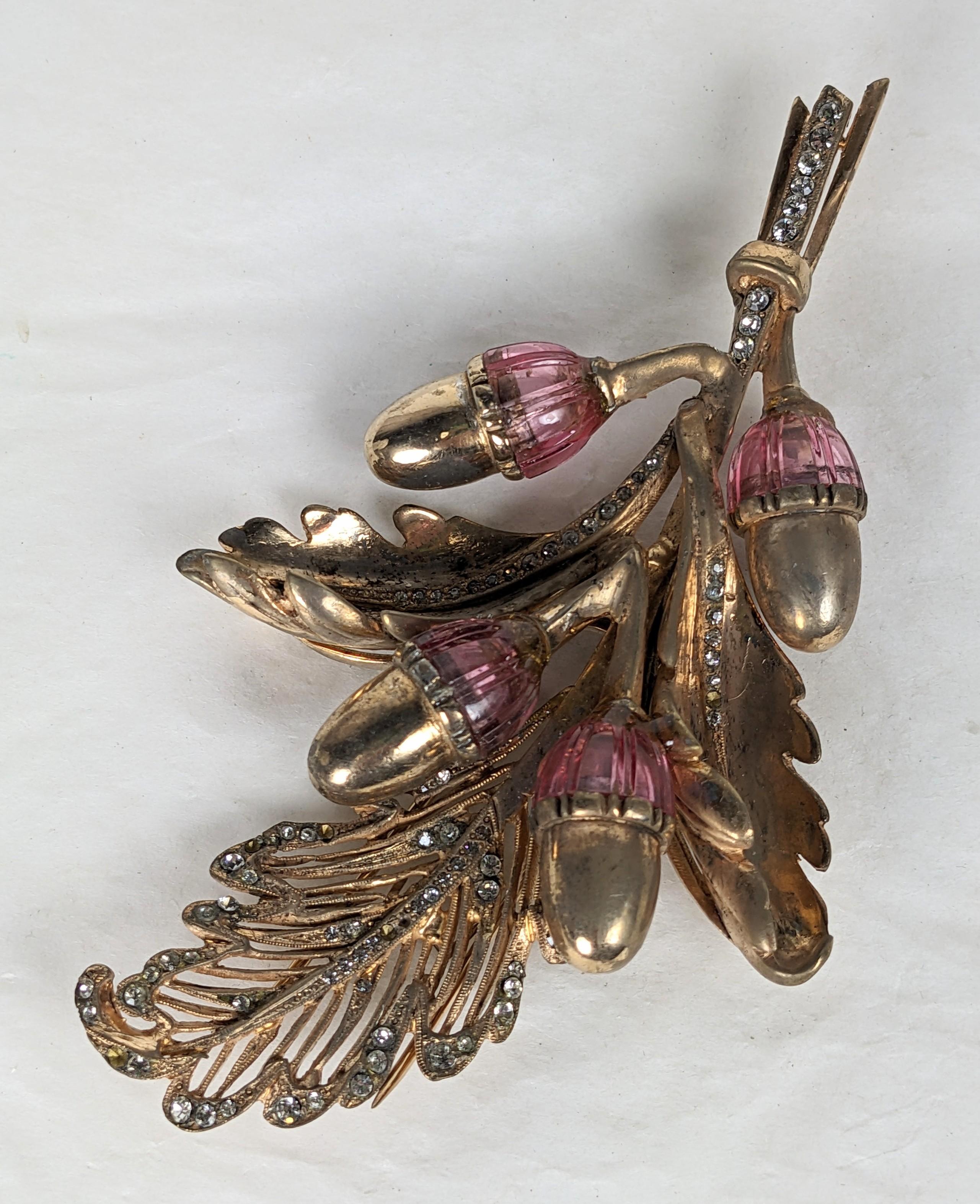 Large and unusual DeRosa Retro Lucite Acorn Clip from the 1940's. Gilt metal with pink lucite scored caps in a retro acorn design. Pave crystal detailing along spine and within pierced leaf. 4.5