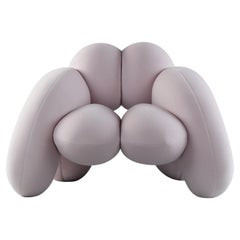 Poltrona Derrière, velluto rosa, scultura moderna organica