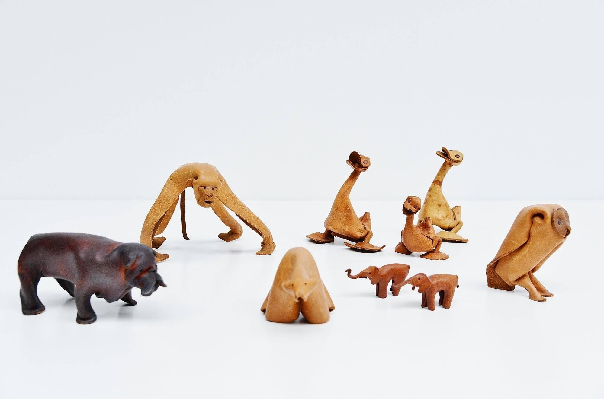 This is for a set of leather sculpted animals made by German company Deru in the 1960s. This set includes a monkey, owl, polar bear, Pitbull, three ducks and two small elephants. Deru made several different leather animals in the 1960s. They are